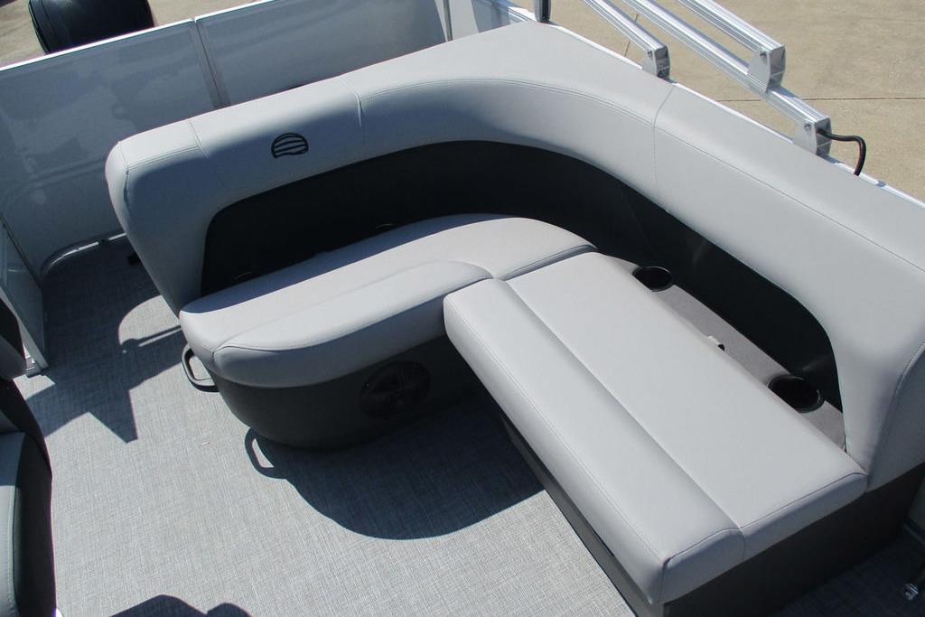 2026 Sun Tracker Party Barge 18 DLX interior seating with gray upholstery and cup holders.
