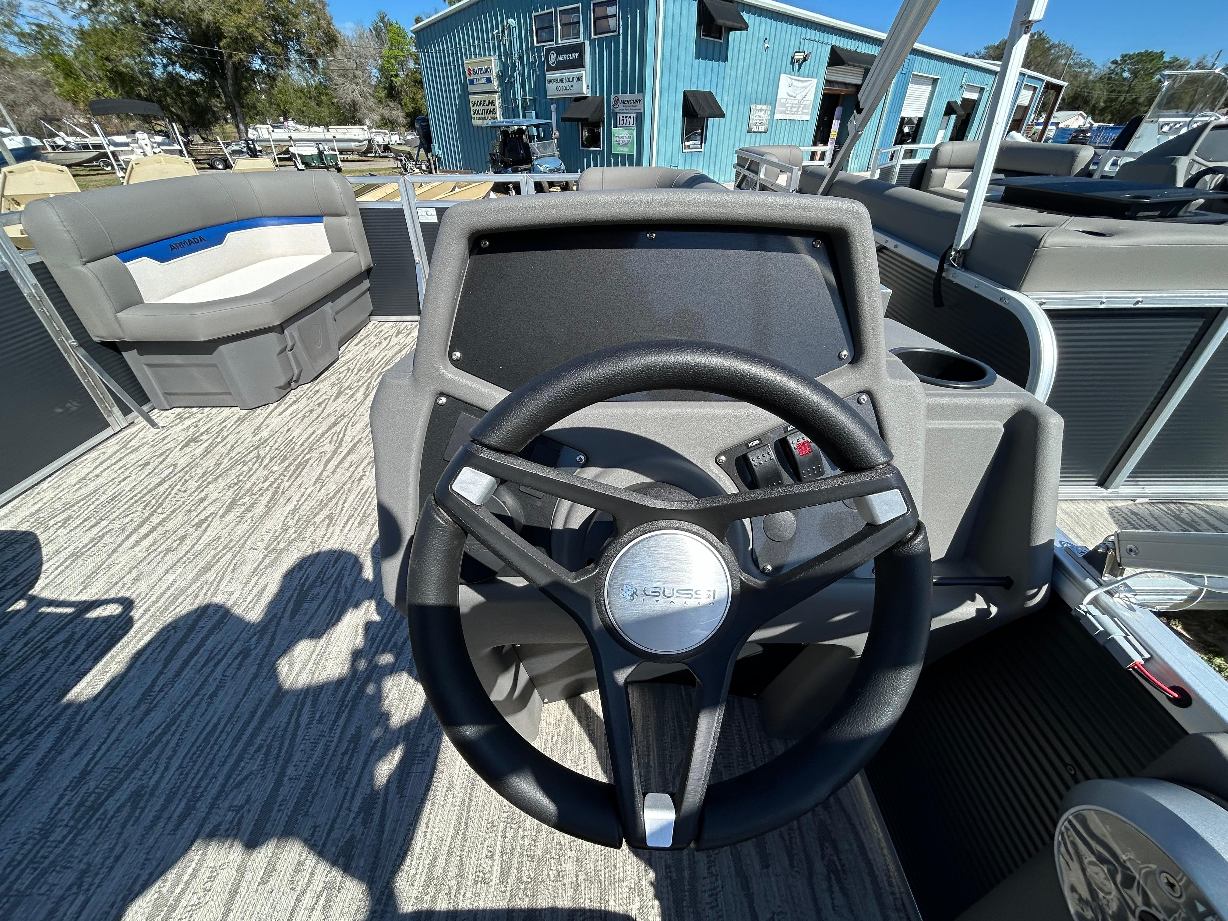 Steering wheel of 2025 Armada Zen Z 168 boat, featuring modern design and spacious seating.