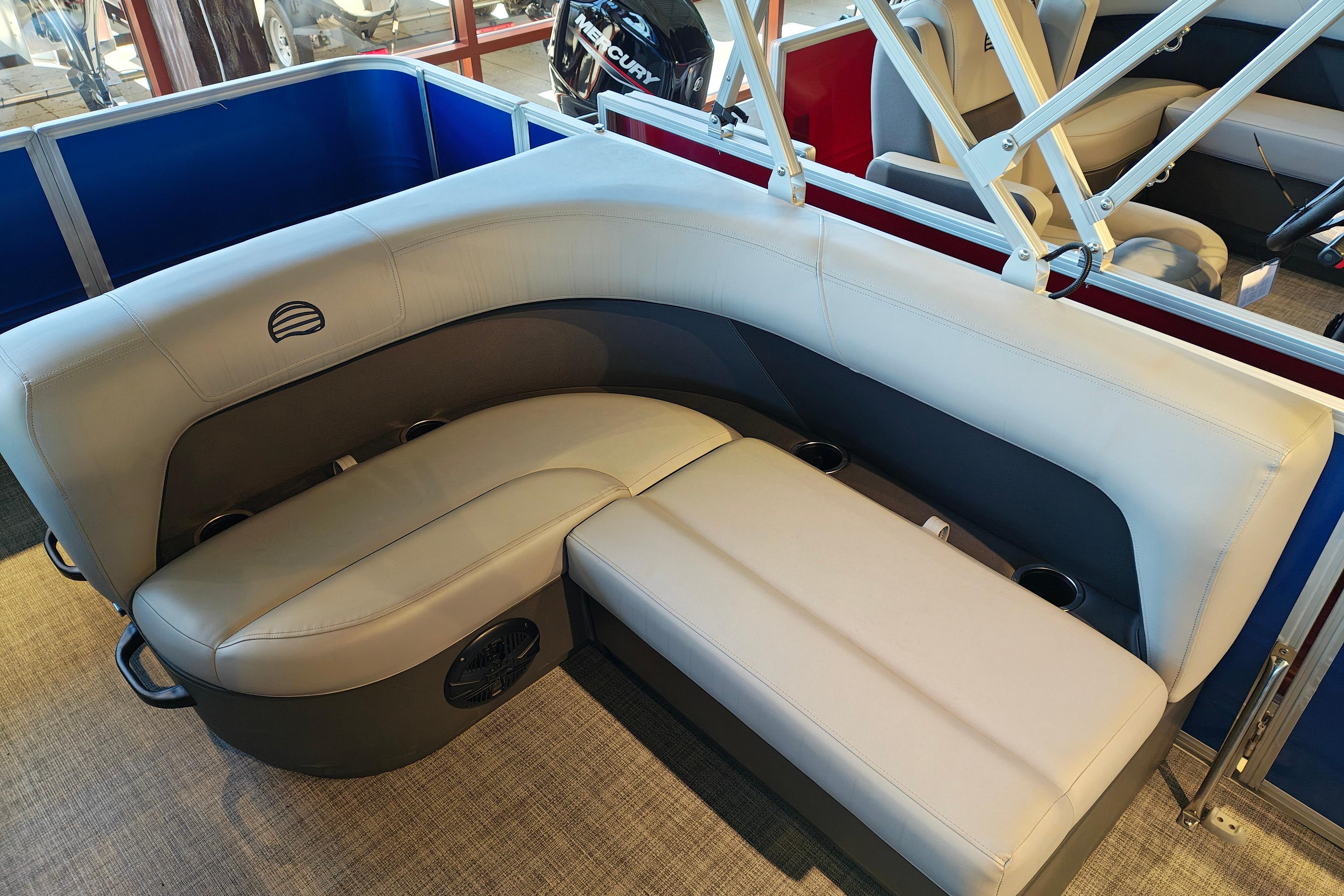 2026 Sun Tracker Party Barge 18 DLX interior seating with cup holders and modern design.