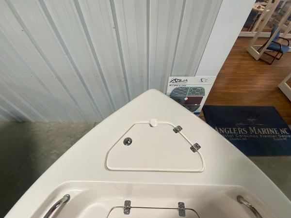 2024 Key West 189 FS boat bow storage compartment in showroom.