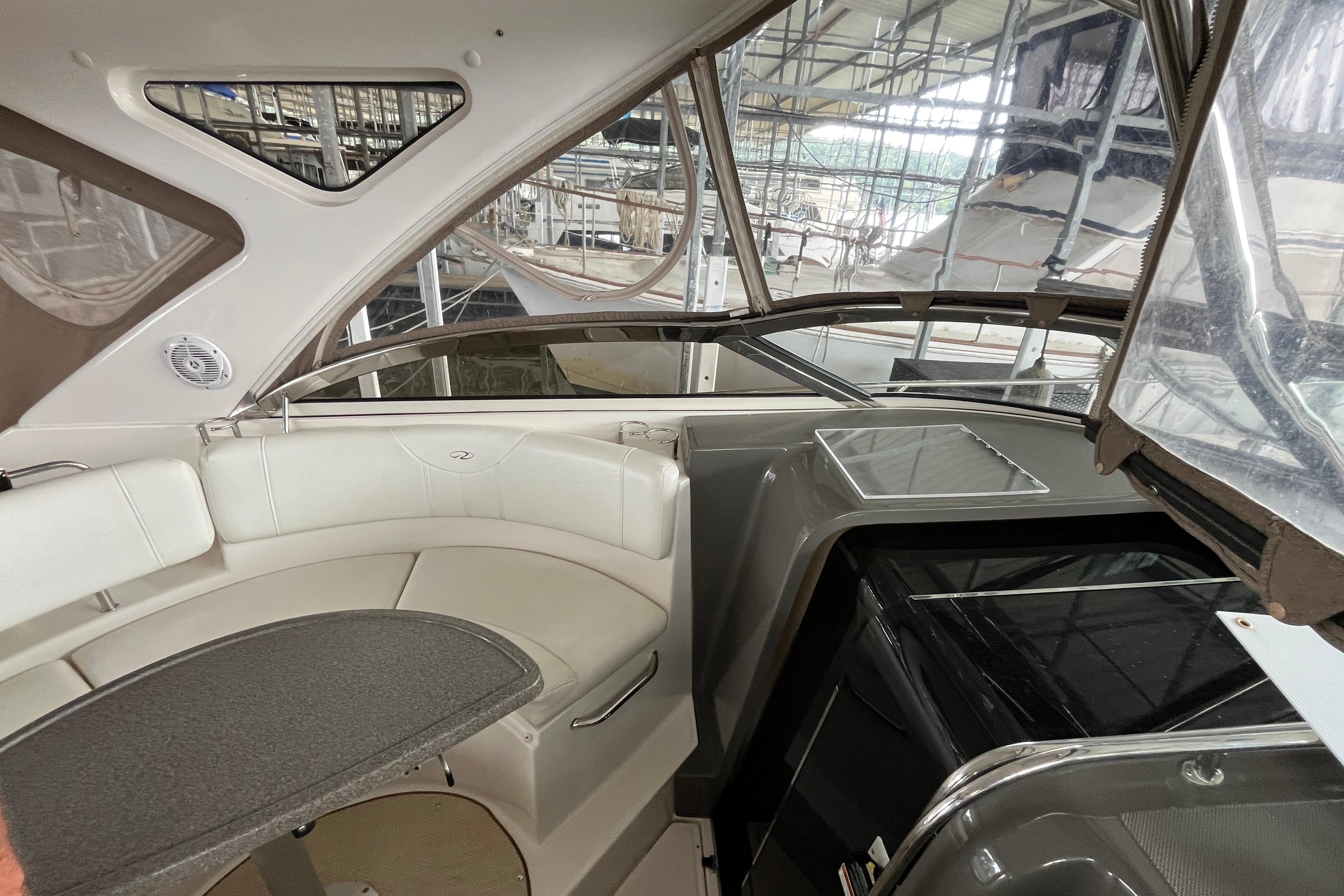 Interior of 2007 Regal 3760 IB Commodore yacht with seating and kitchenette.