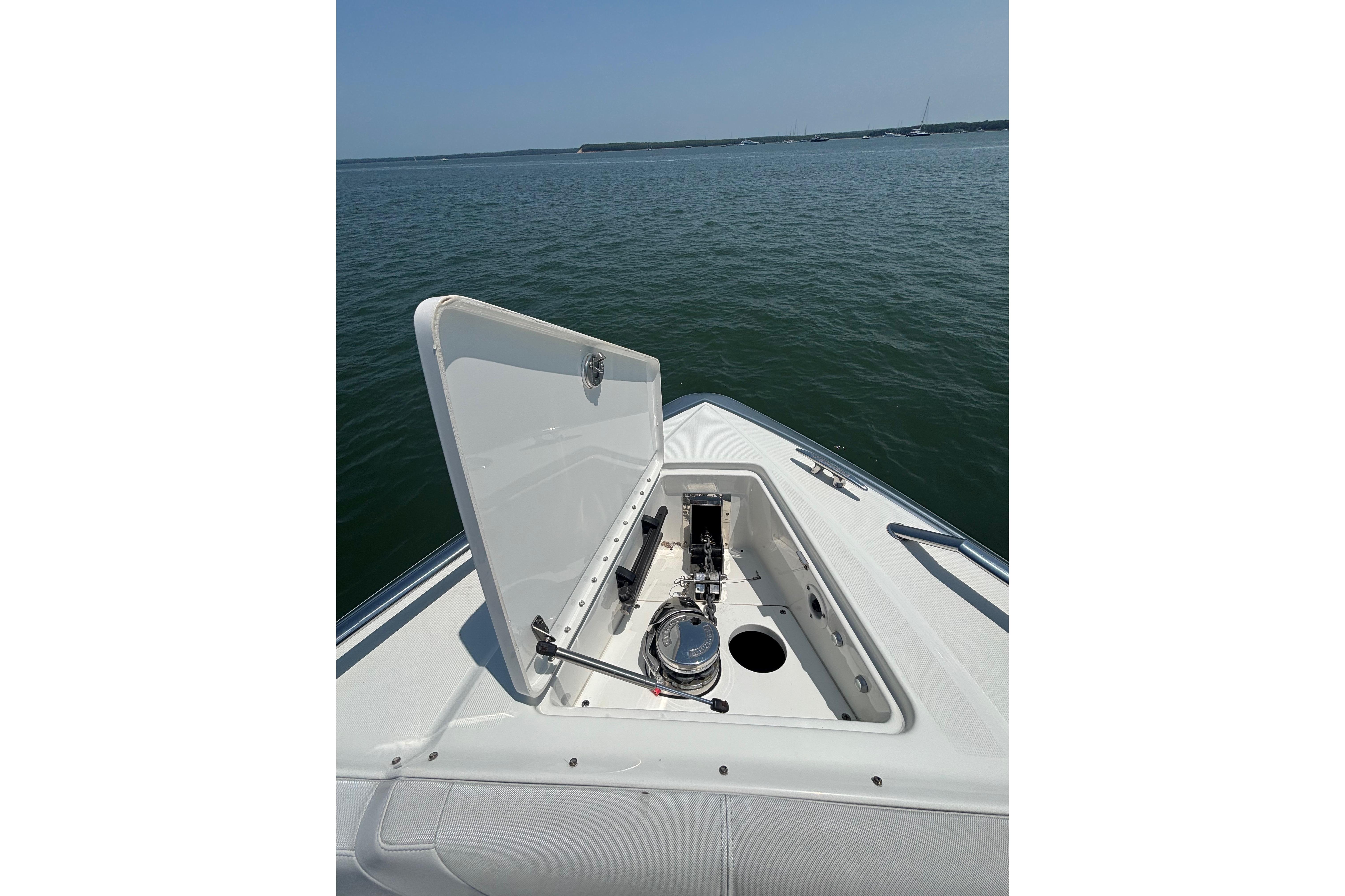 Open hatch on 2019 Formula 430 Super Sport Crossover boat, revealing anchor storage.