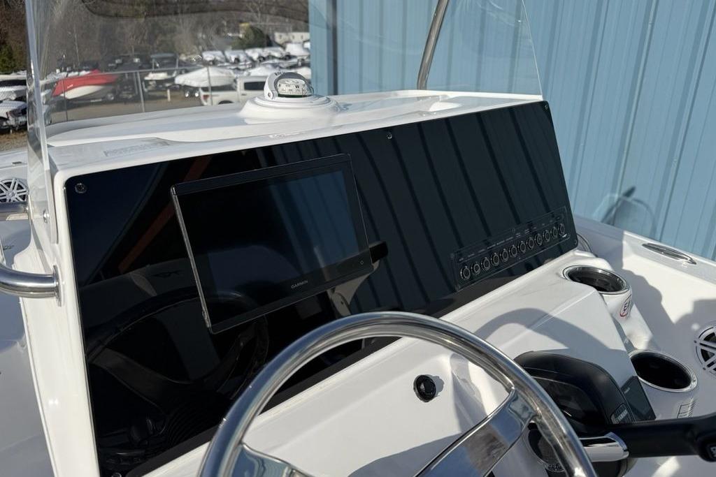 2026 Tidewater 198 CC Adventure boat dashboard with steering wheel and navigation display.