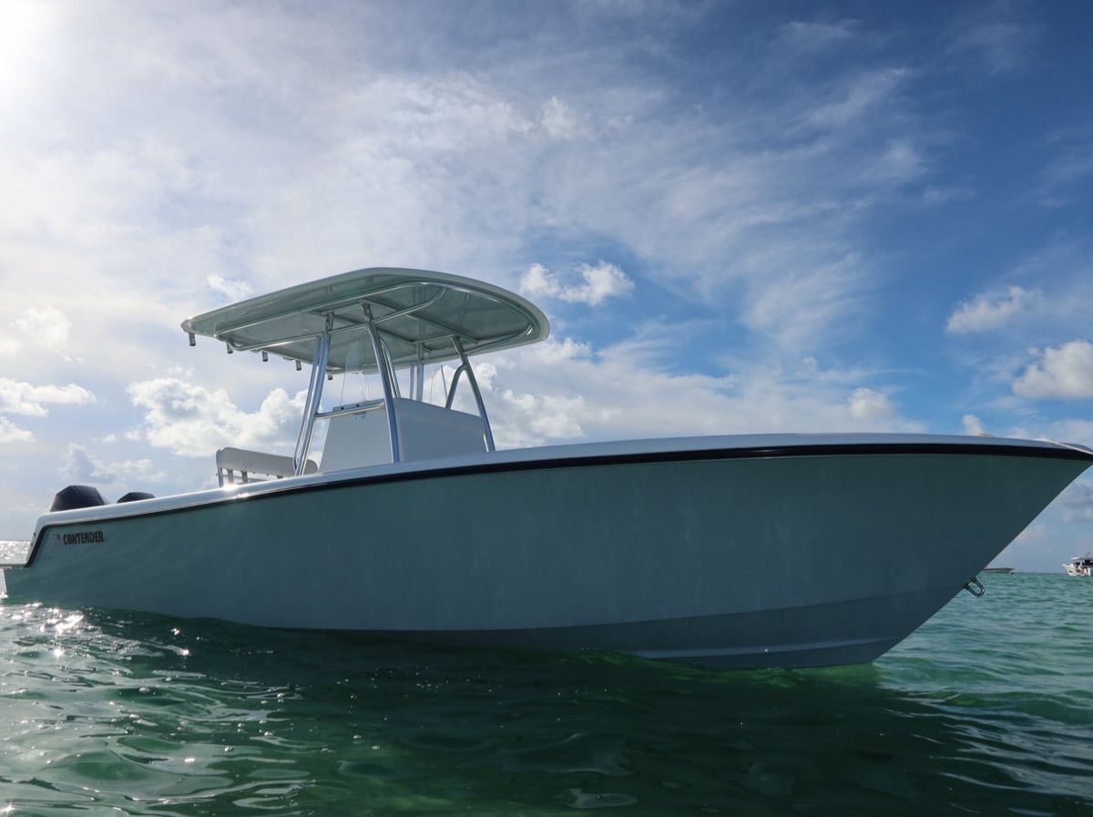A 2026 Contender 28 Tournament boat on calm water under a blue sky.