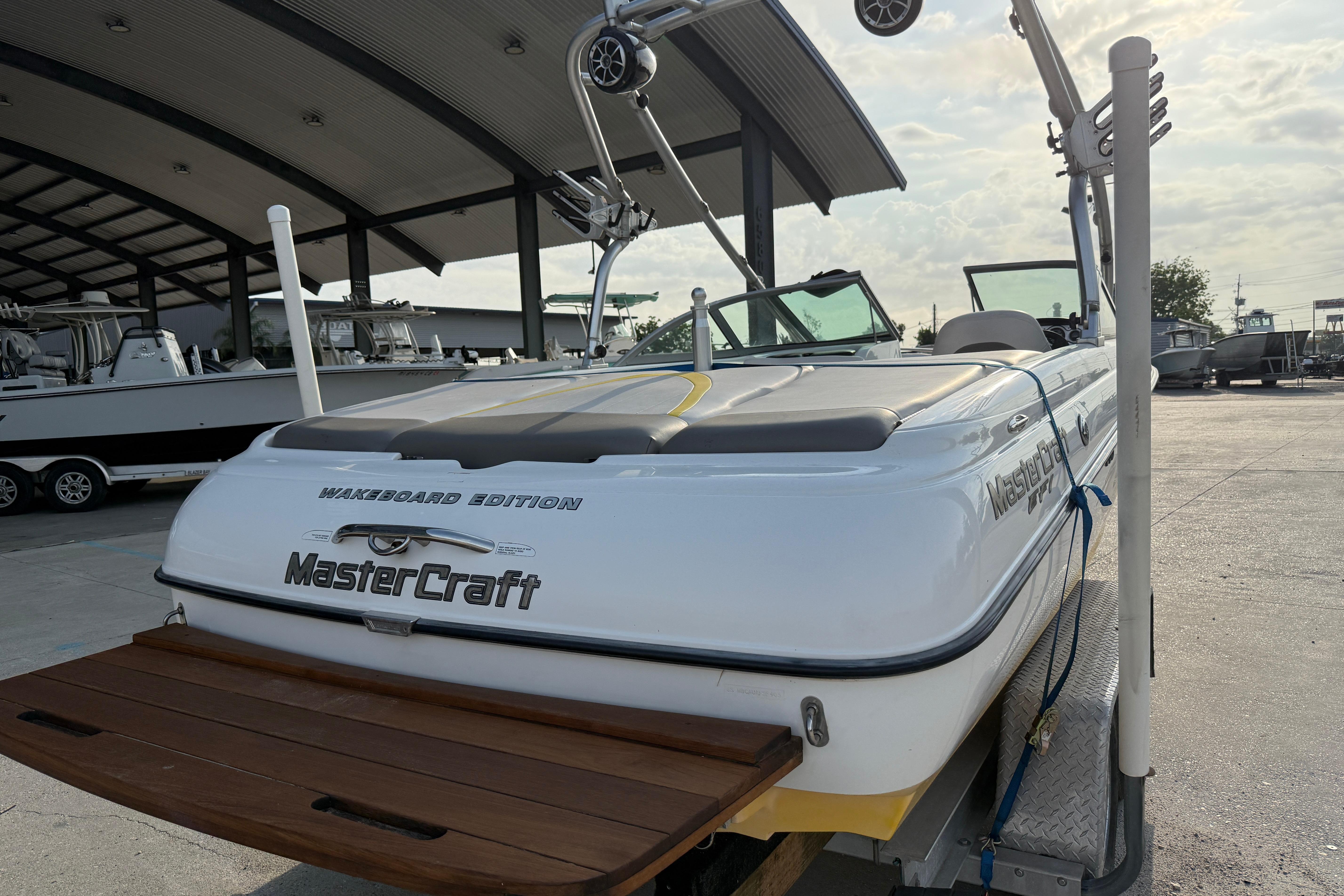 2005 MasterCraft X10 Wakeboard Edition boat in a marina setting.