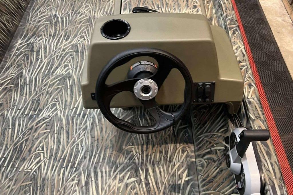 2026 Tracker Grizzly 1648 SC steering console with camouflage design.