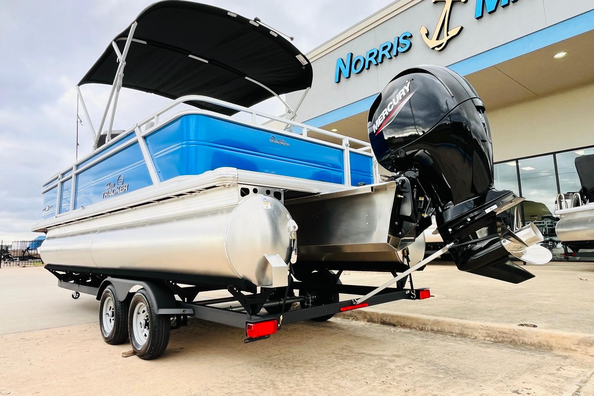 2026 Sun Tracker Party Barge 22 RF DLX with Mercury engine at dealership.