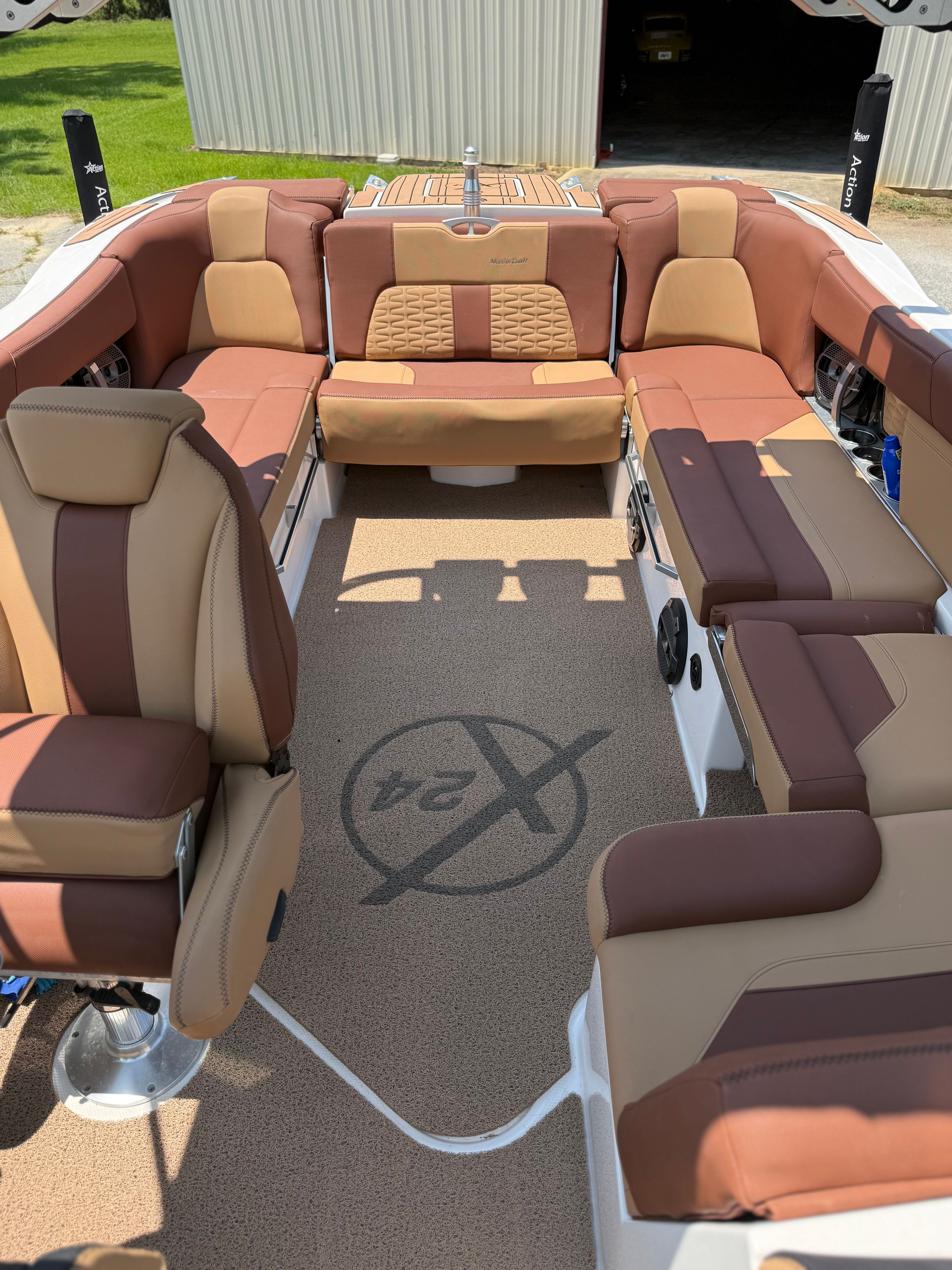 Interior of a 2021 MasterCraft X24 with brown and beige seating.