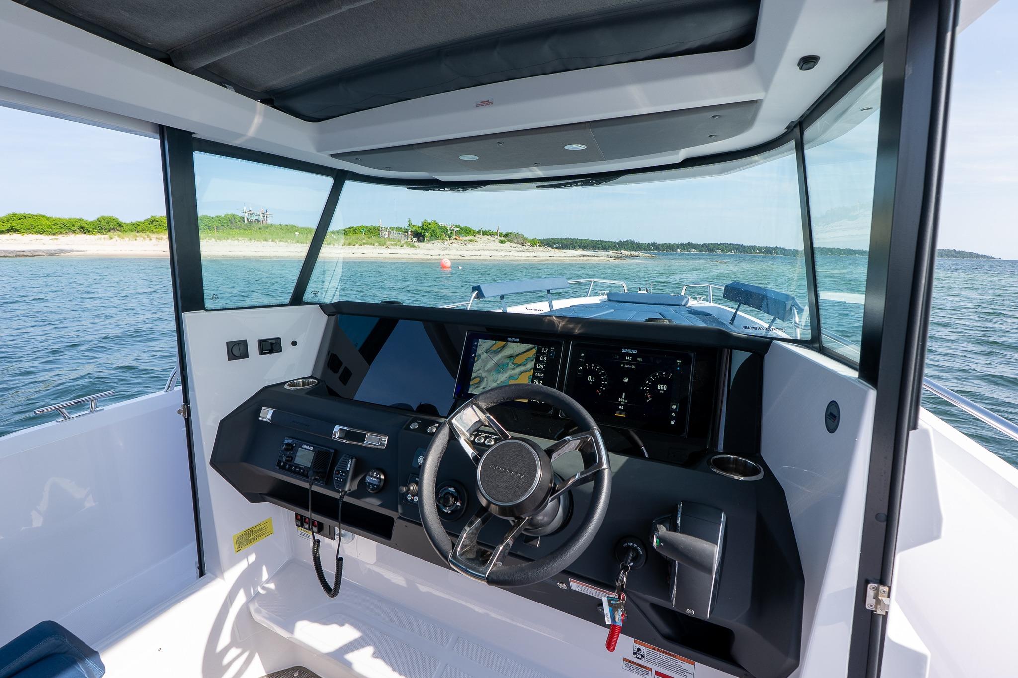 Interior view of 2026 Axopar 29 XC Cross Cabin boat with modern dashboard.