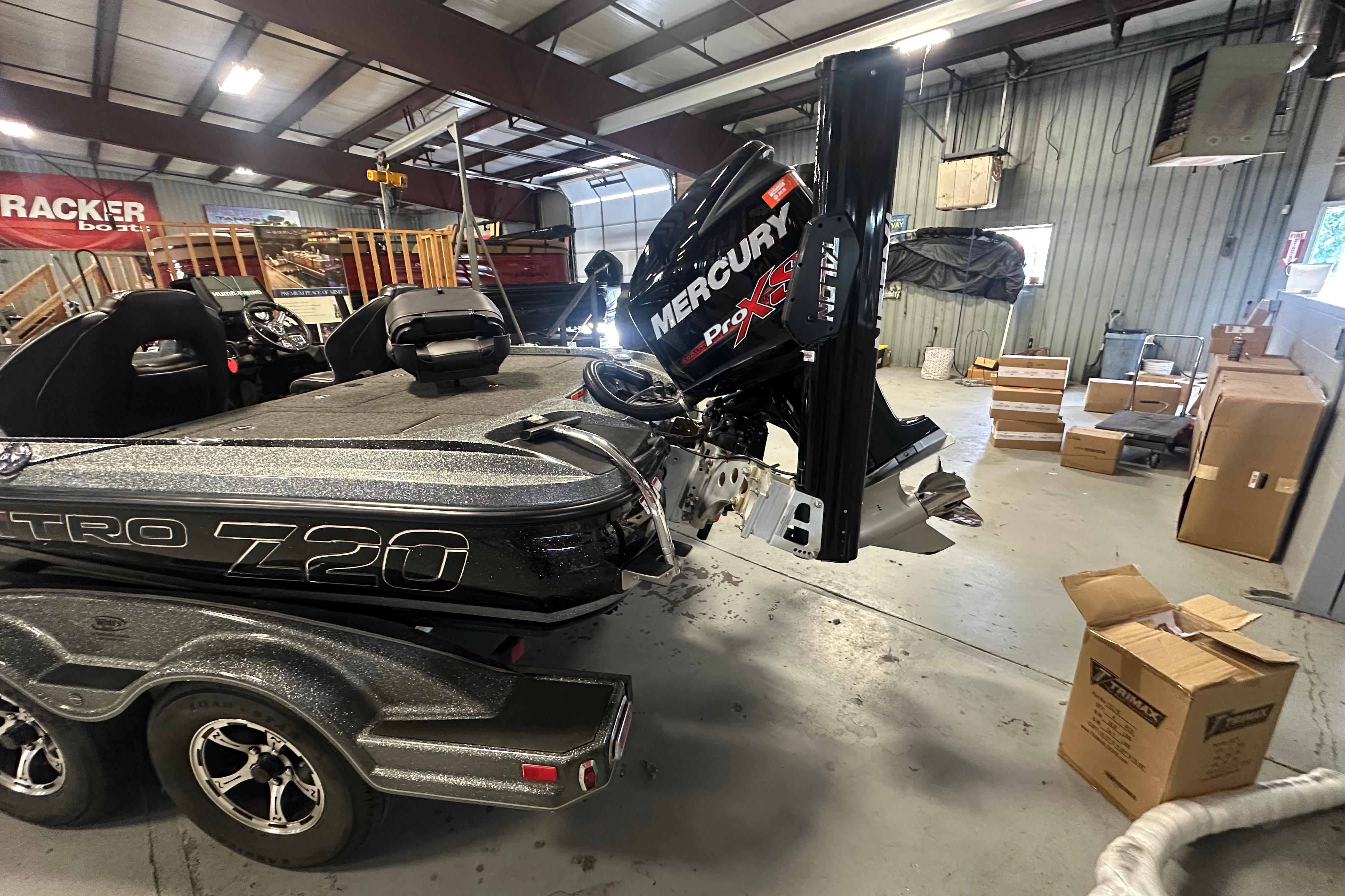 Nitro Z20 Pro 2018 boat with Mercury Pro XS engine in a workshop setting.