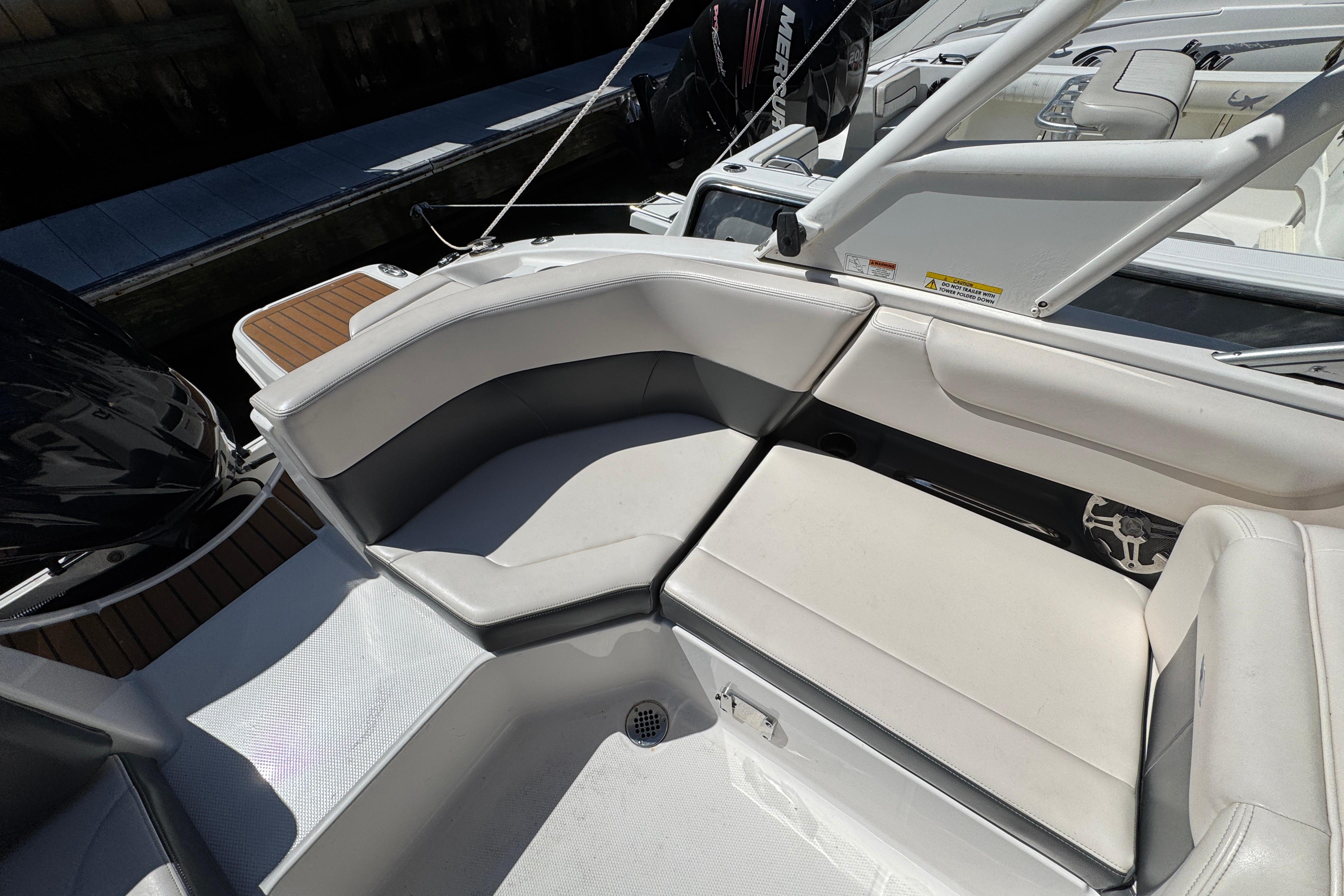 2018 Chaparral 250 Suncoast boat interior with white seating and sleek design.