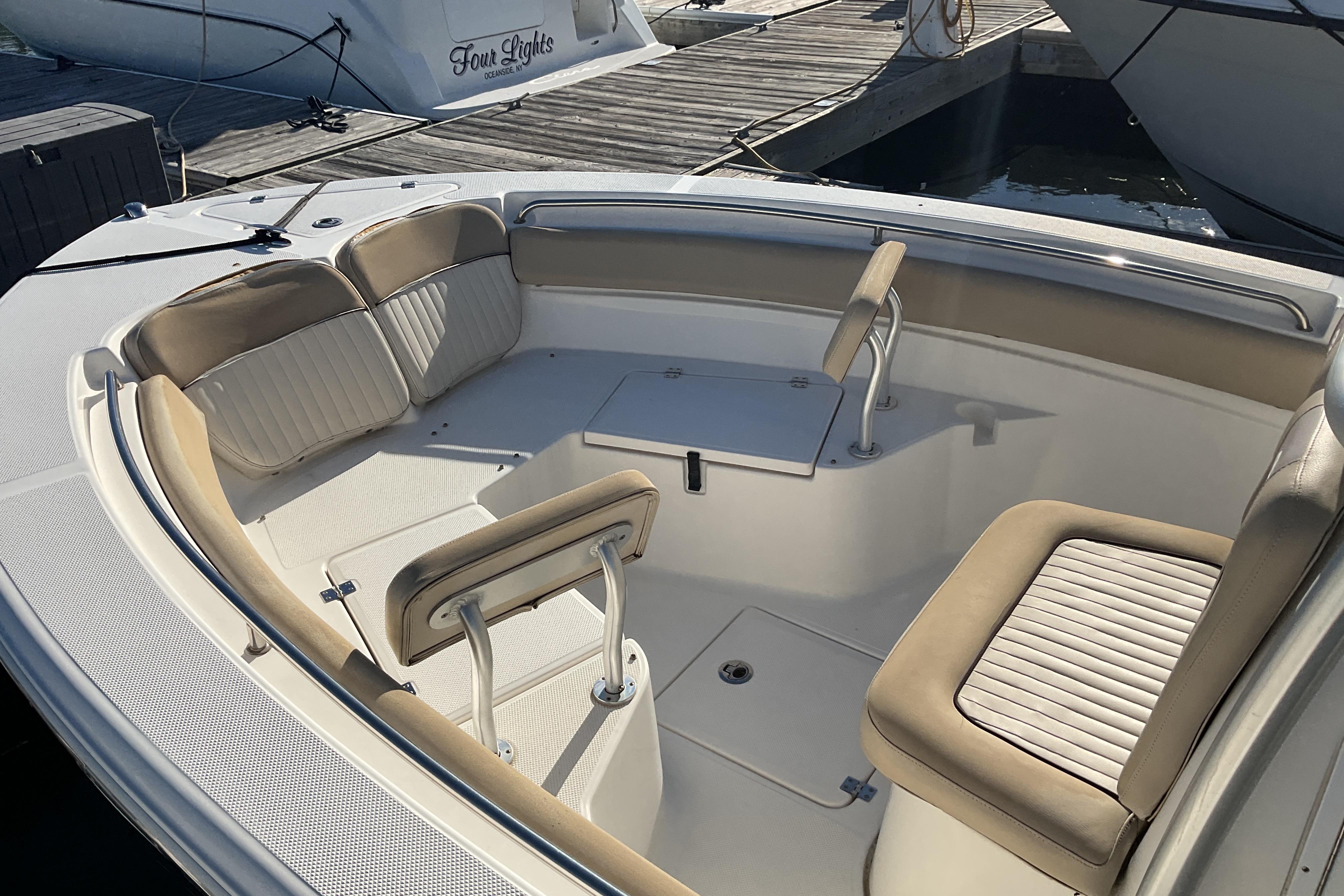 2016 Sea Fox 226 Commander boat interior with cushioned seating and storage compartments.