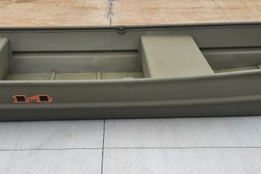 2026 Tracker Grizzly 14 Jon boat on concrete surface.