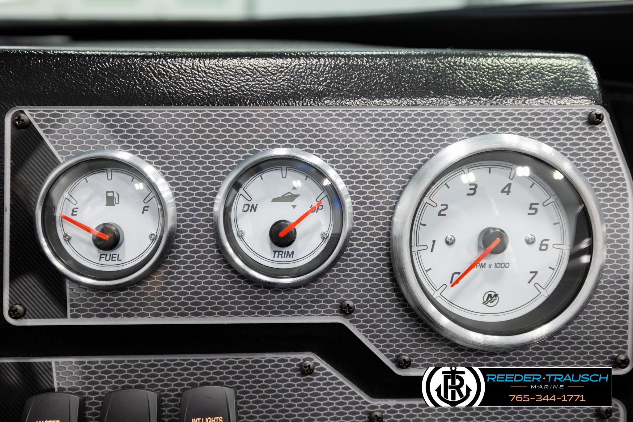 Dashboard gauges of a 2026 Lund 1975 Tyee boat, featuring fuel, trim, and RPM indicators.