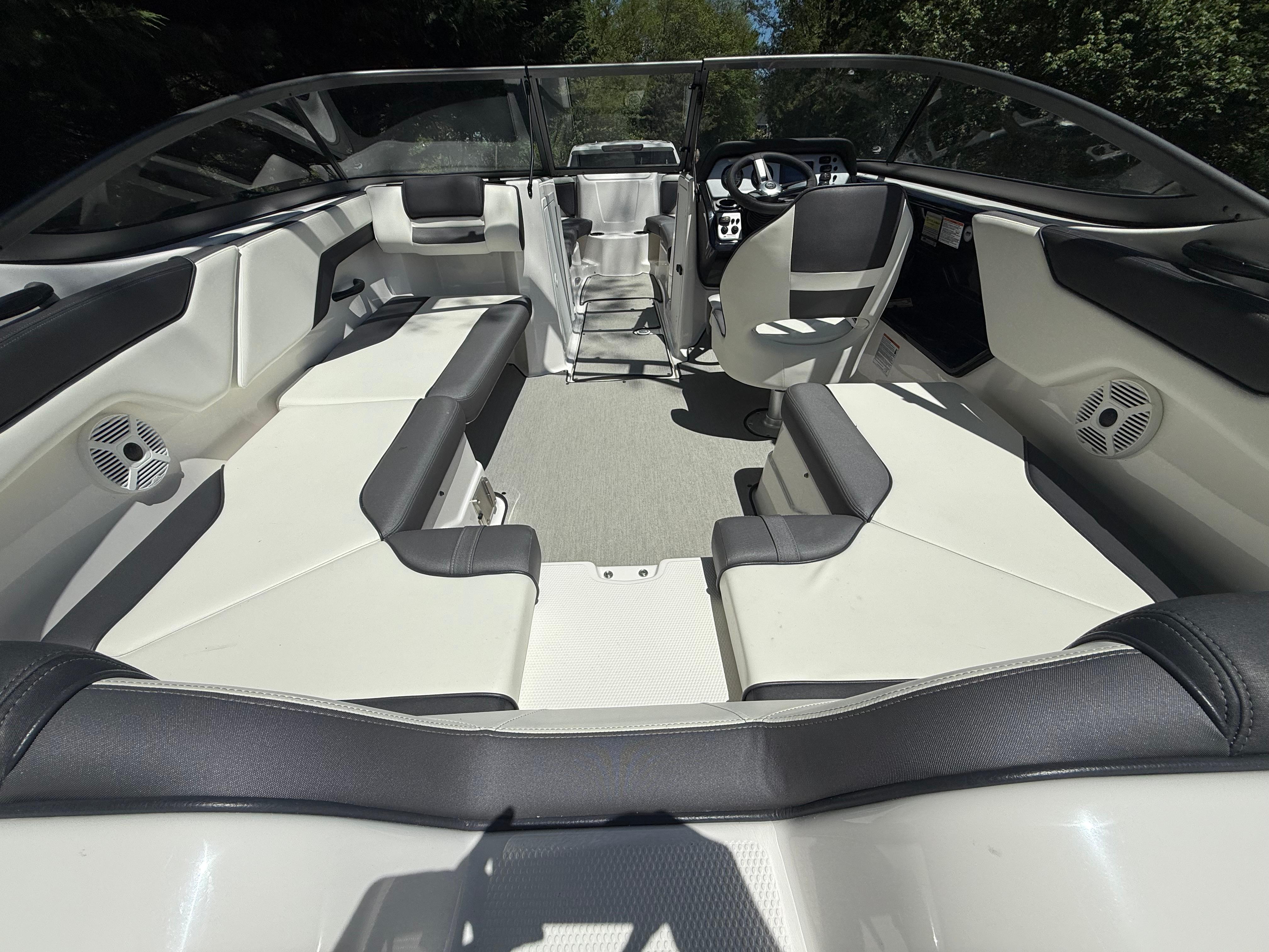 2022 Yamaha Boats AR210 interior with sleek seating and modern dashboard design.
