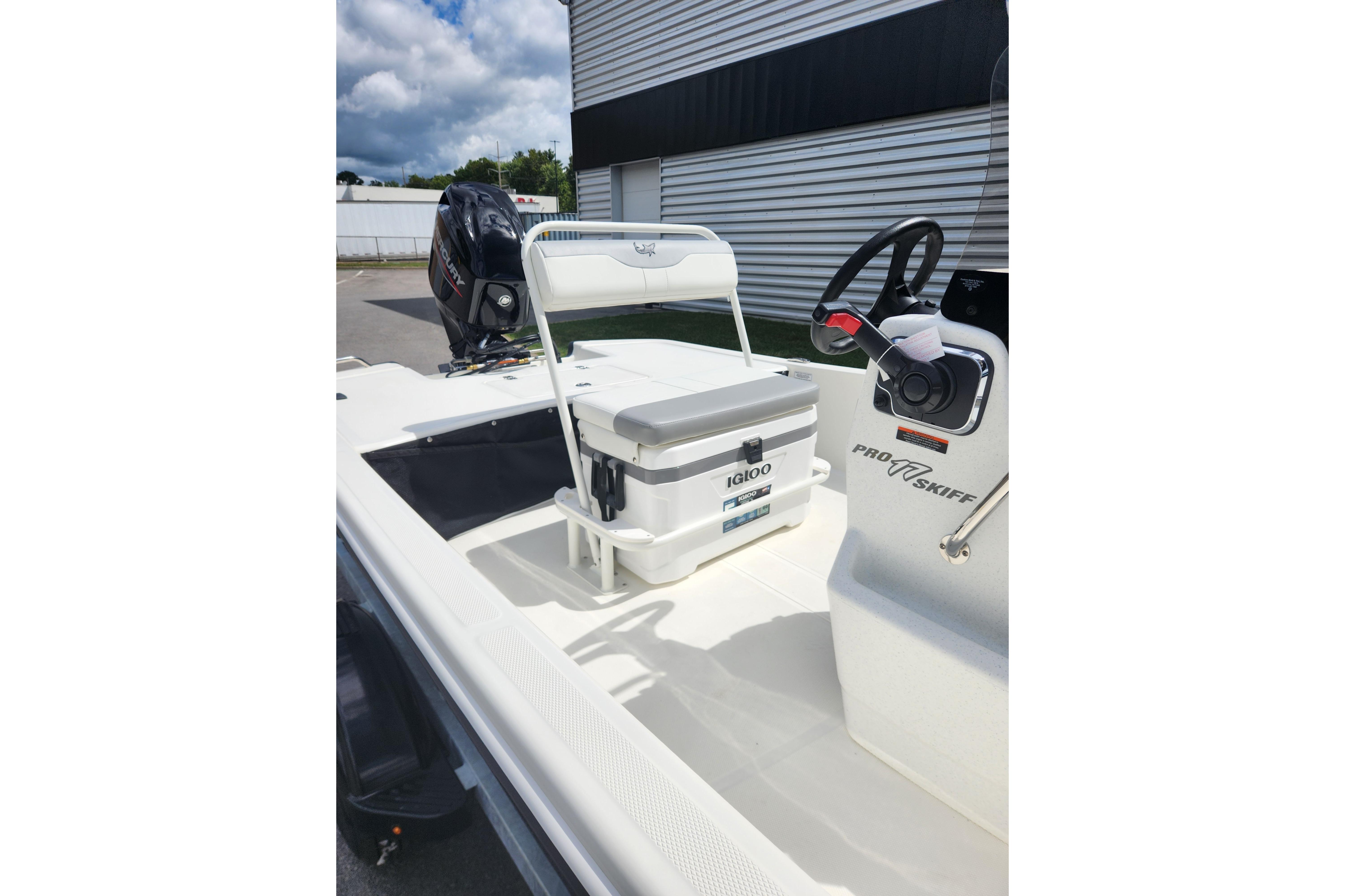 2026 Mako Pro Skiff 17 CC boat interior with Igloo cooler and steering console.
