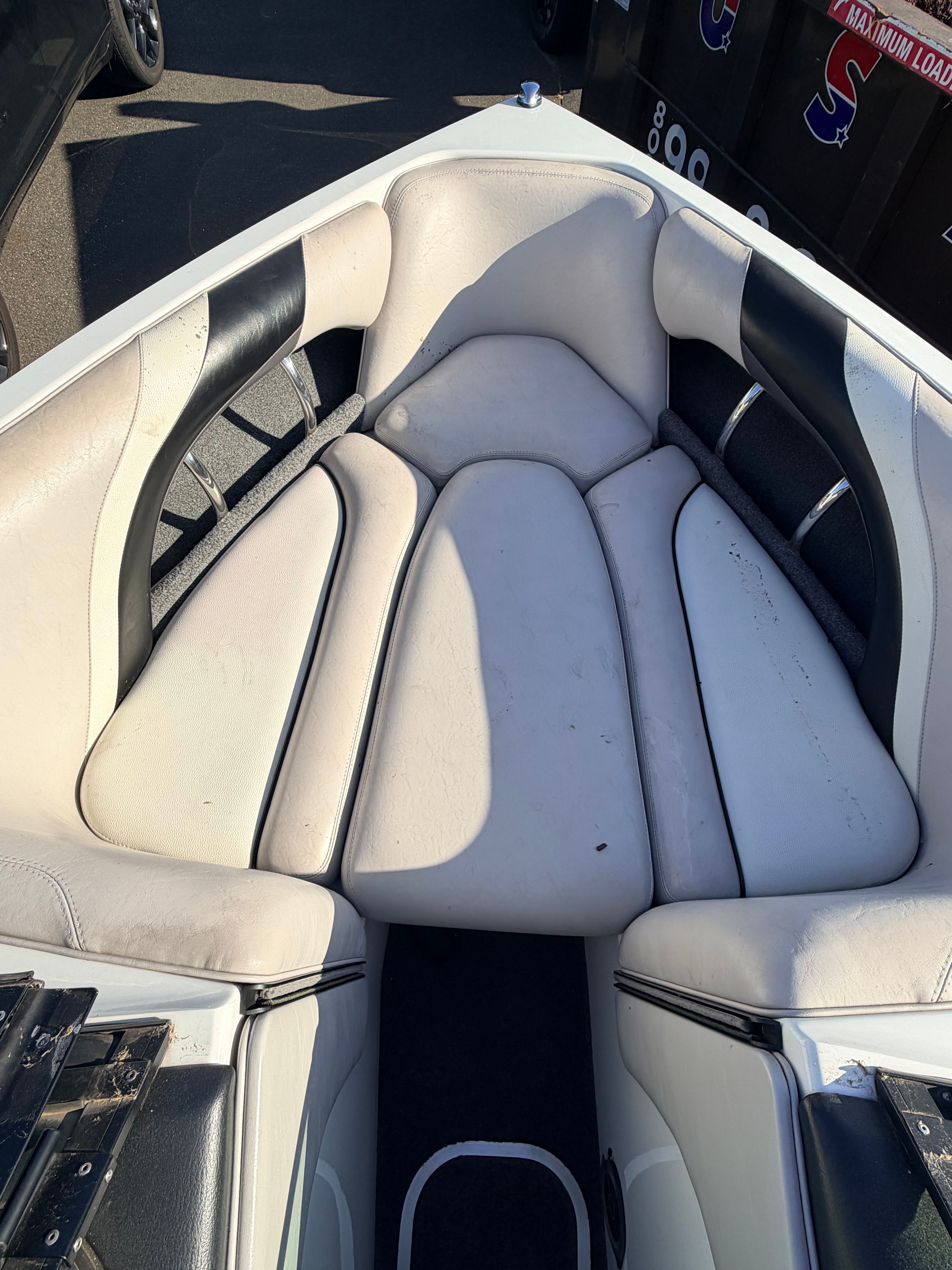 Interior of a 2006 Malibu iRide boat with white seating.