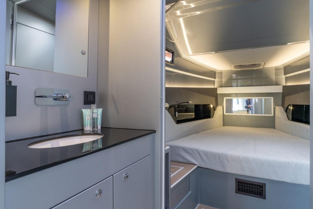 Modern interior of 2026 Pirelli 50 FB yacht with sleek bathroom and cozy sleeping area.