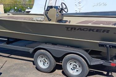 2026 Tracker Grizzly 2072 CC boat on trailer, side view.