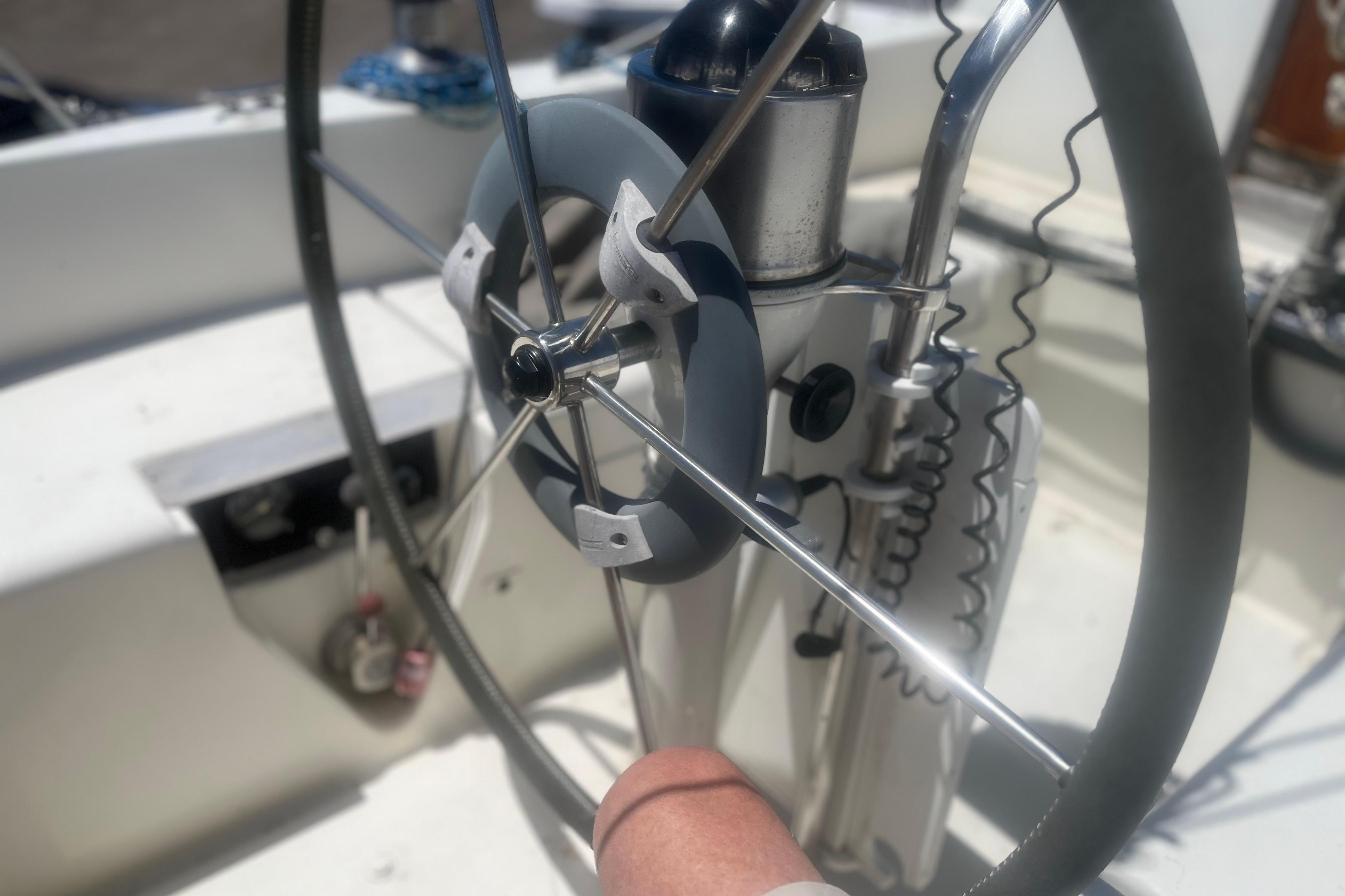 Steering wheel of a 1972 C&C 30 sailboat, showcasing nautical equipment details.