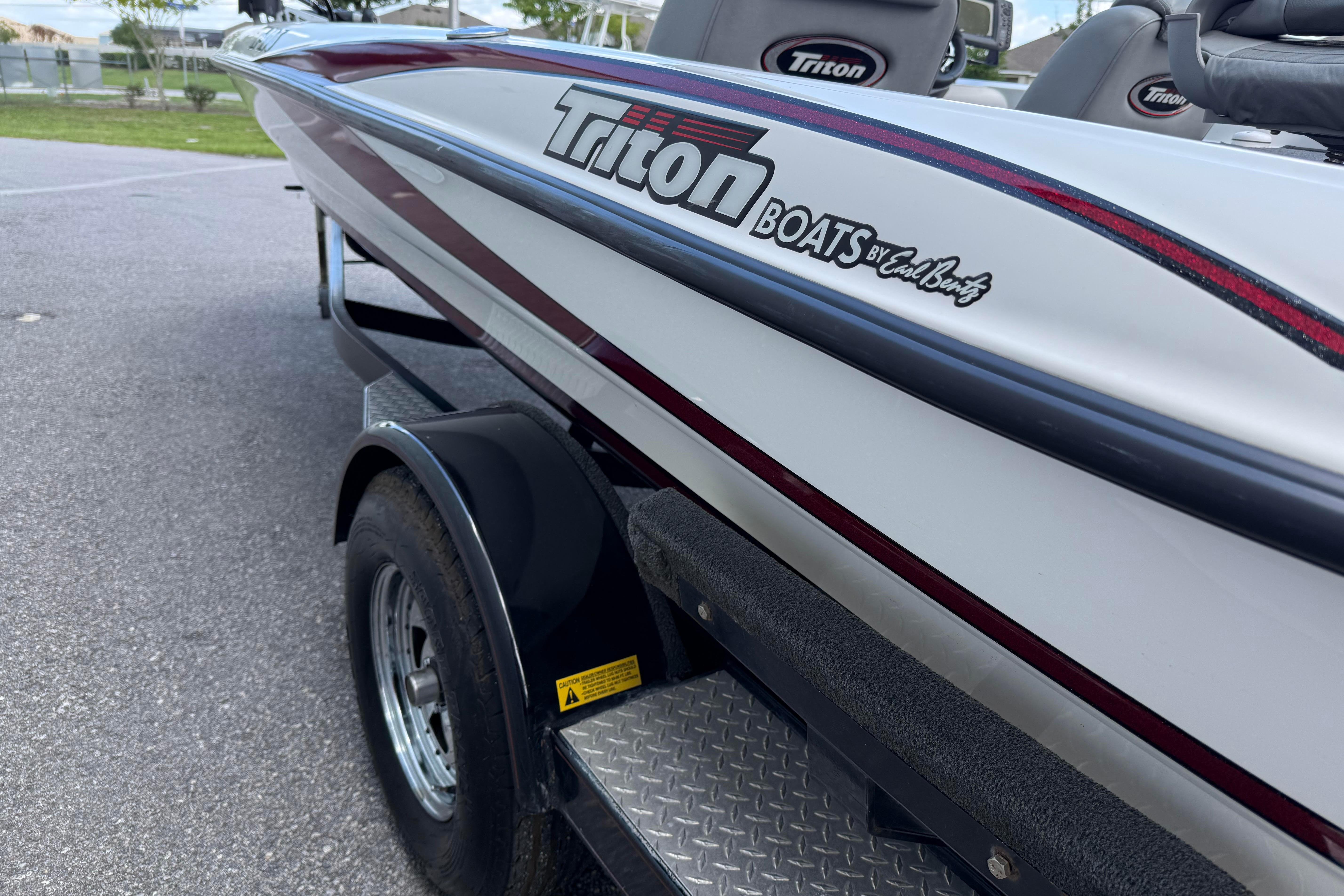 2007 Triton TR-196 boat on trailer, showcasing sleek design and branding details.