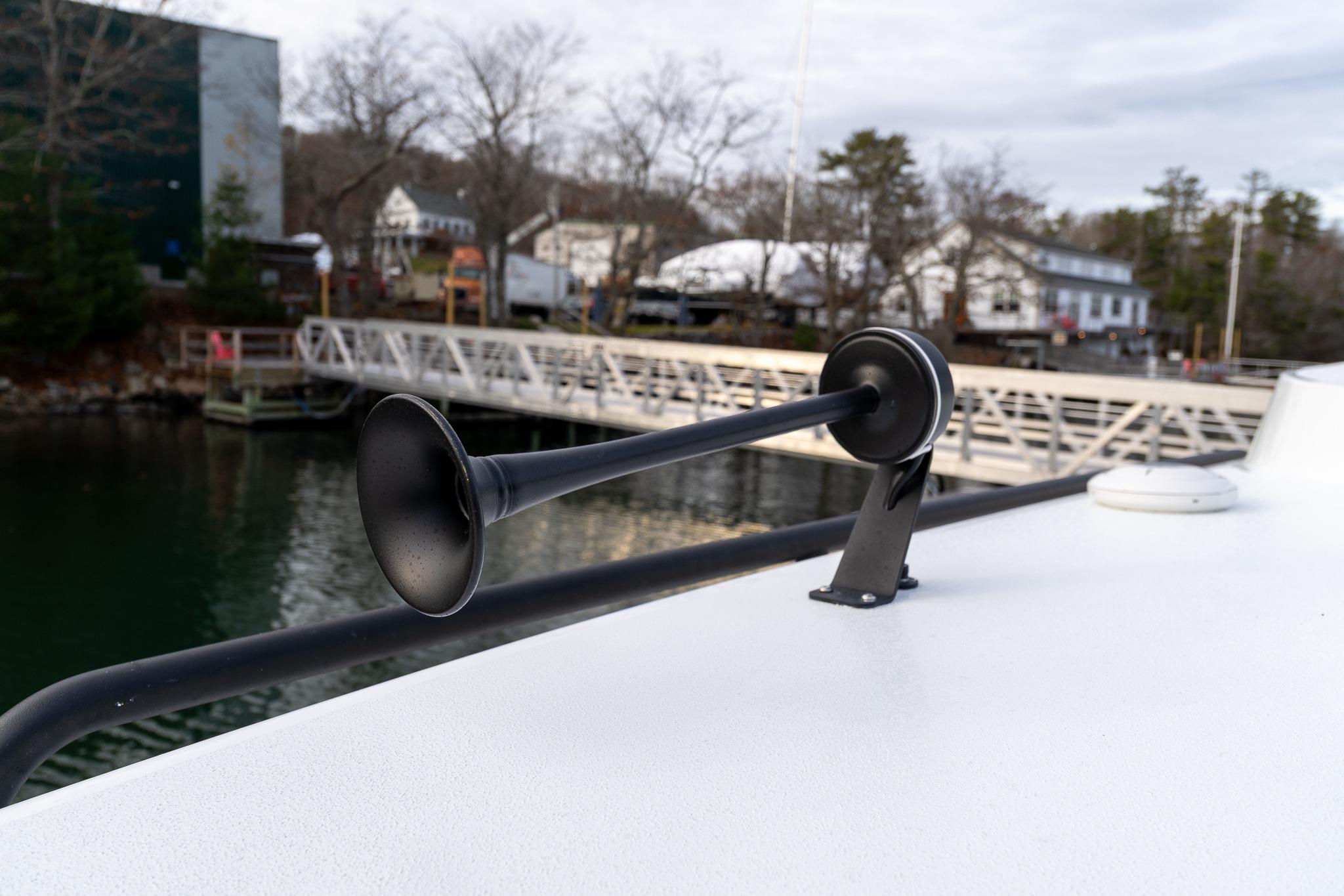 2026 Targa 27.2 boat horn on deck near marina.