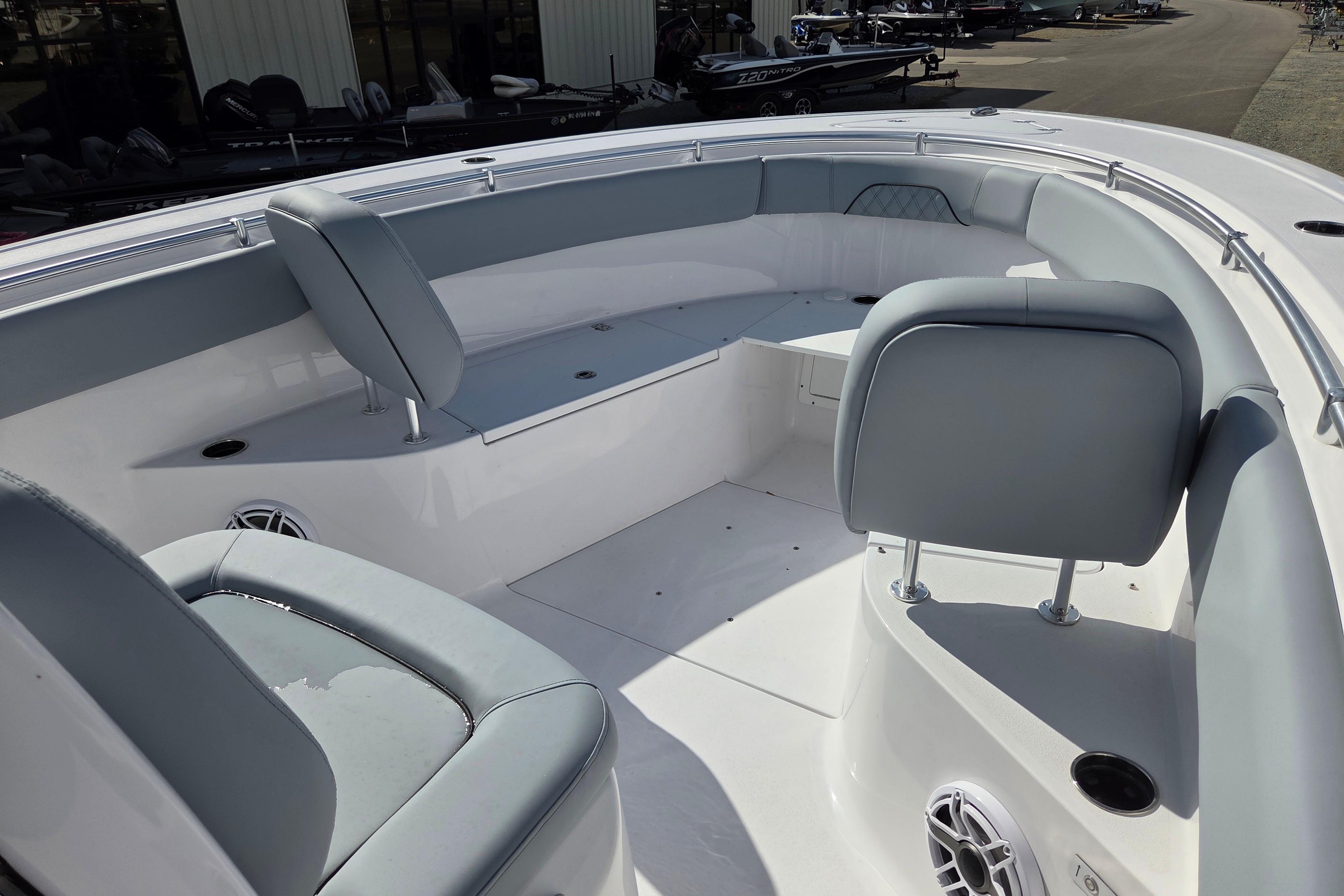 2026 Sportsman Open 282 Center Console boat interior with cushioned seating and storage.