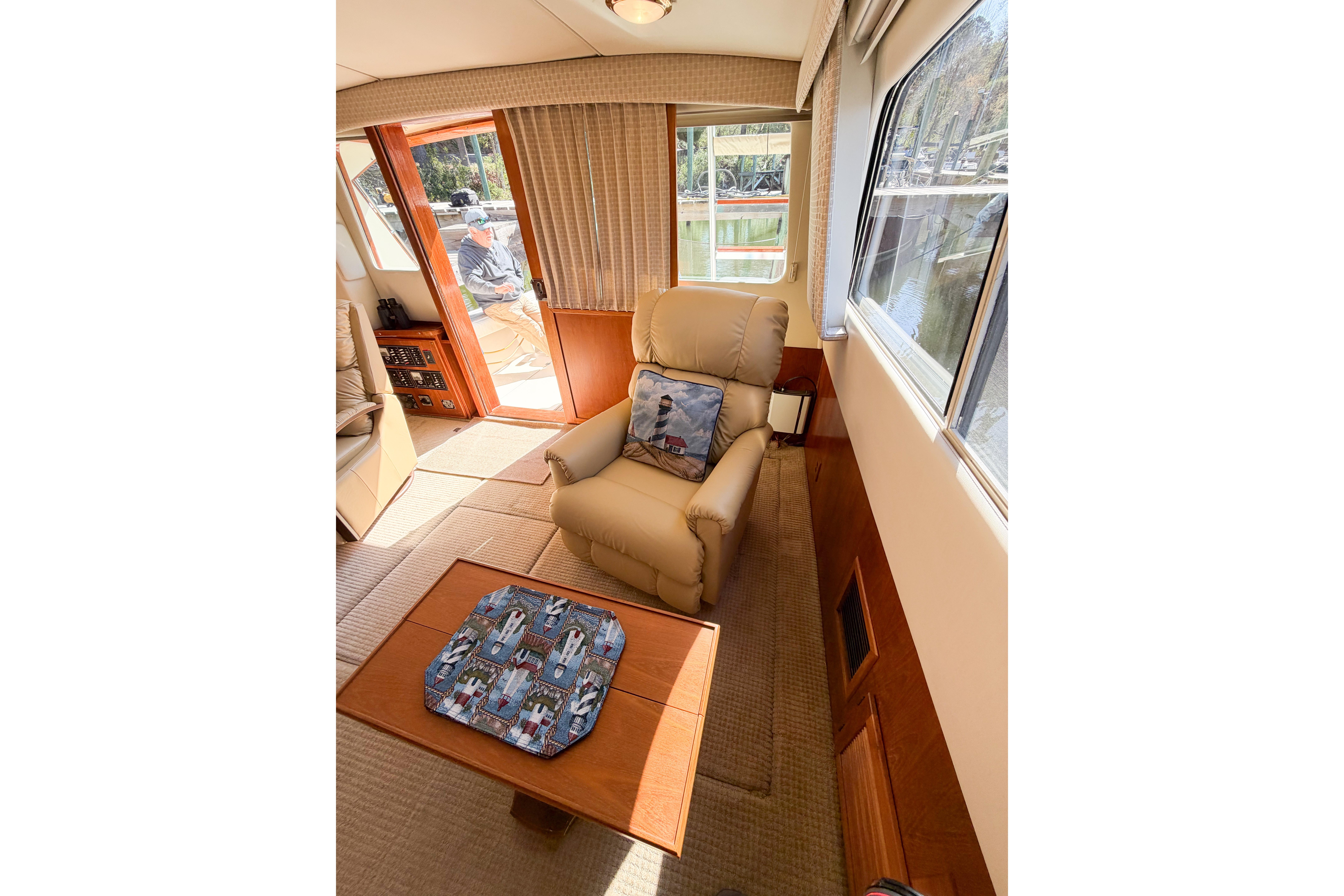 Interior of 1988 Pacemaker 36 Convertible yacht with comfortable seating and natural light.