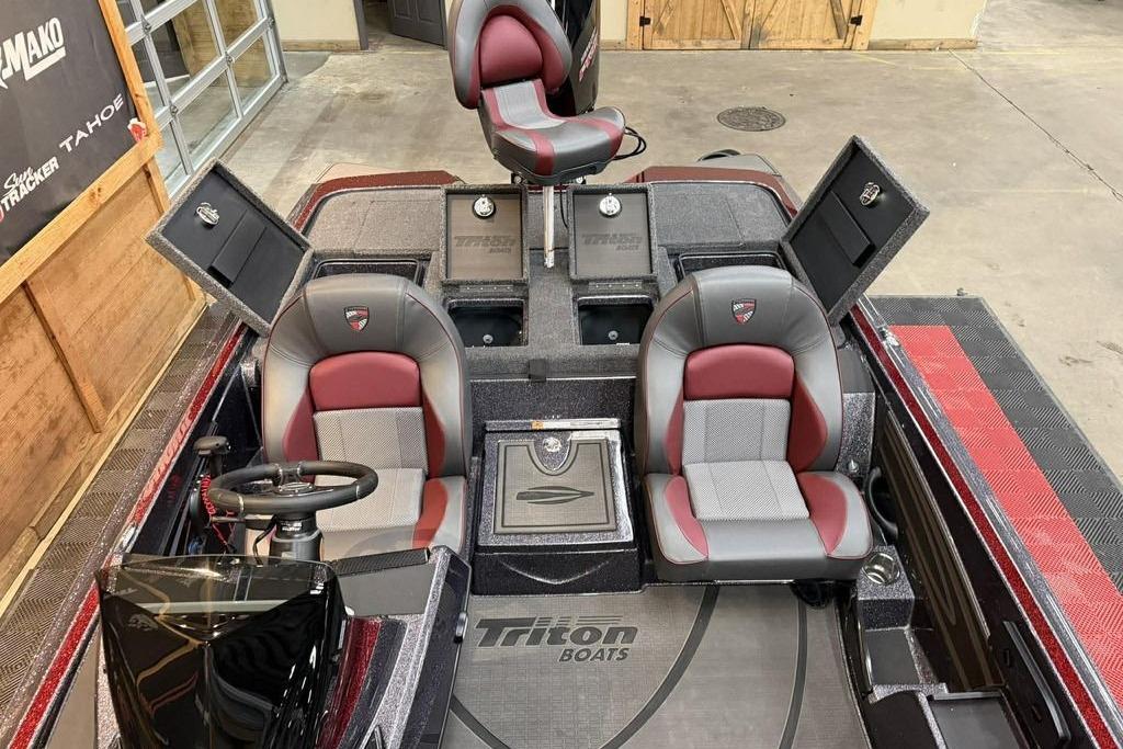 Interior of 2026 Triton 20XP Patriot boat with red and gray seating.