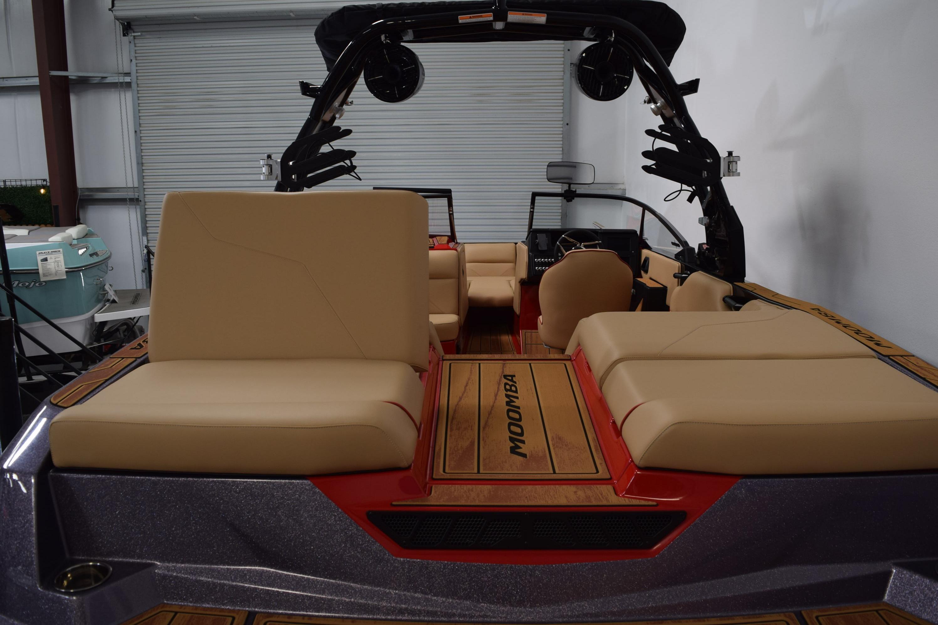 2026 Moomba Max boat interior with beige seating and sleek design.