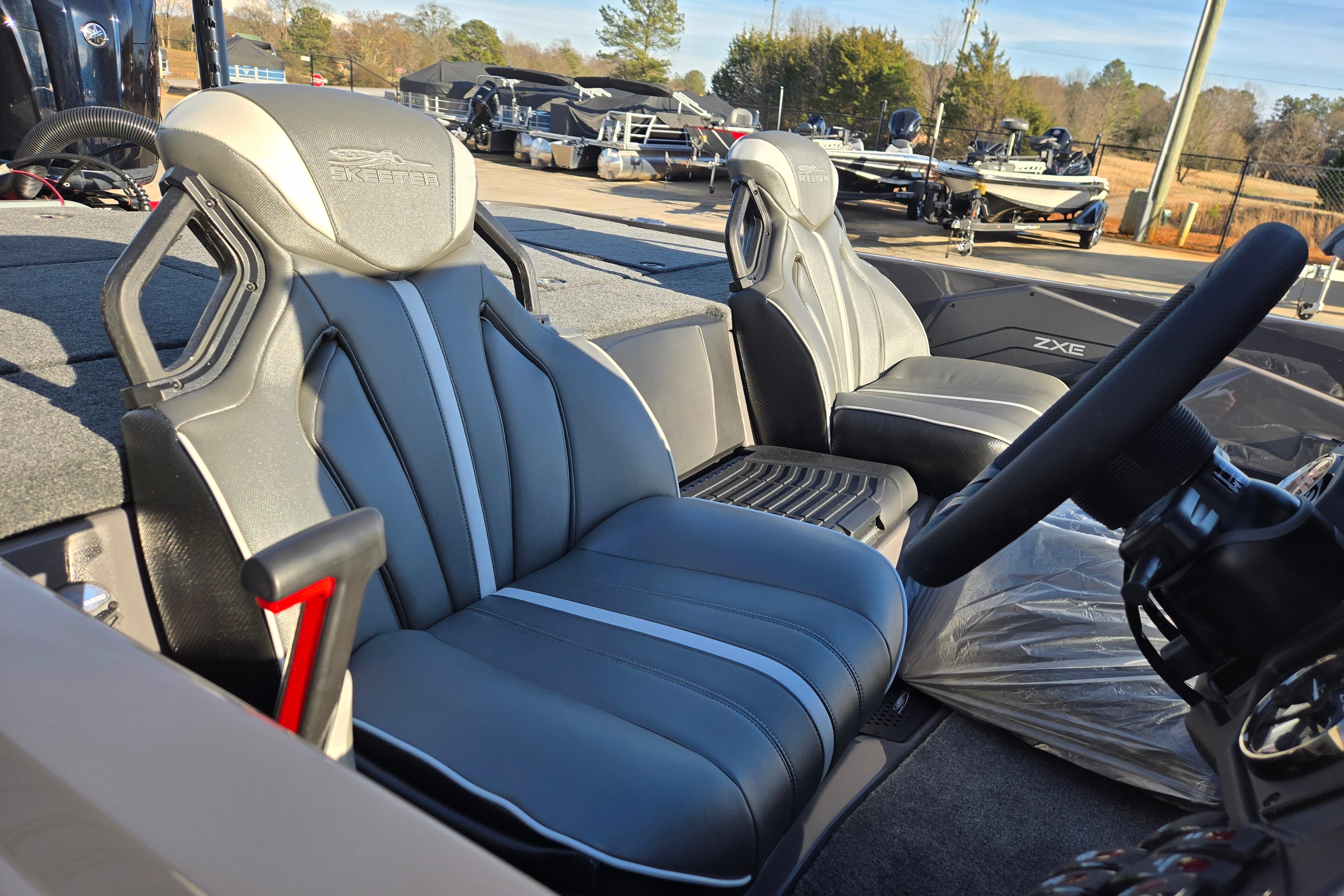 2026 Skeeter ZXE21 boat interior with sleek, modern seating and steering wheel.