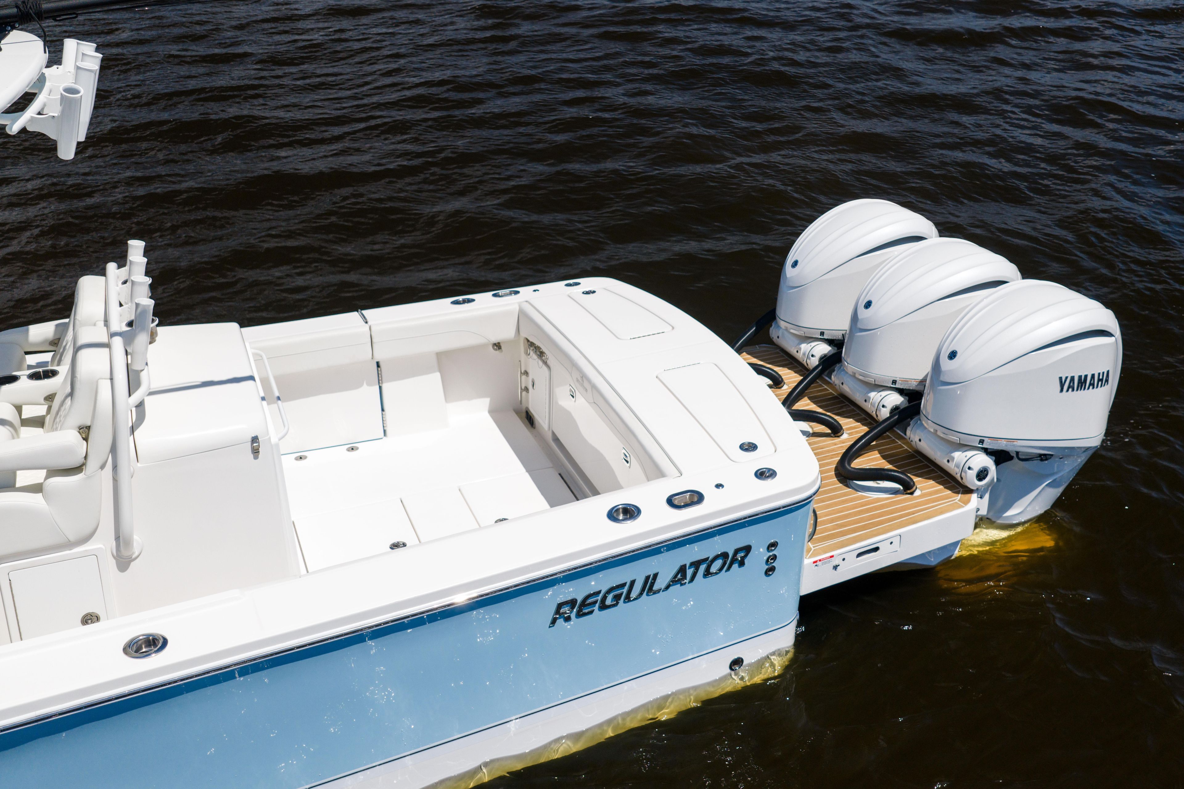 2024 Regulator 34 boat with triple Yamaha engines on water.