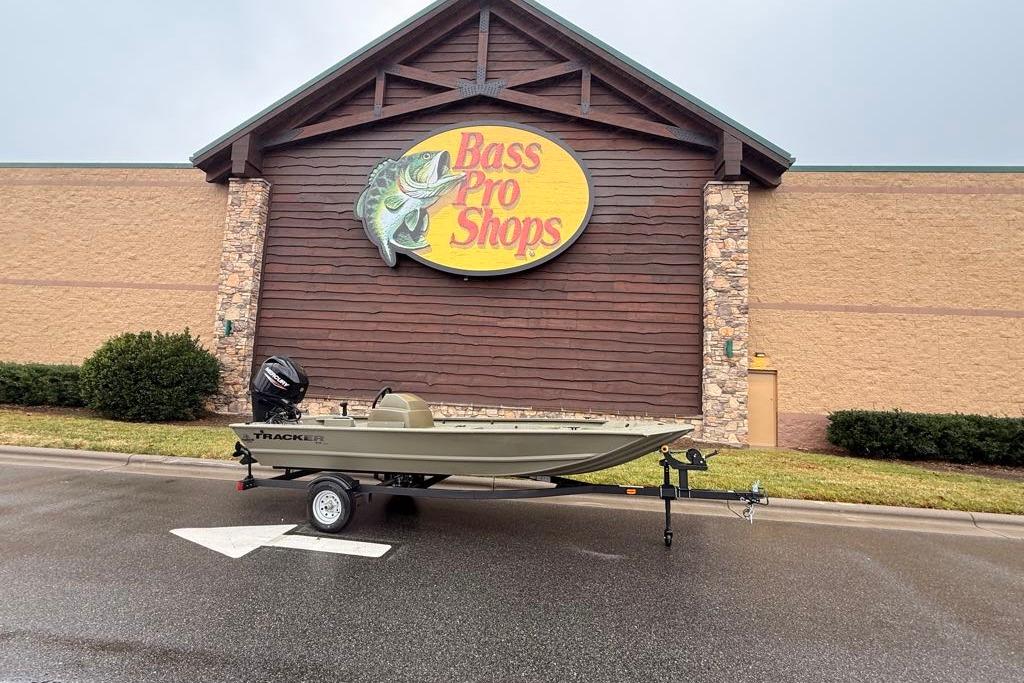 2026 Tracker Grizzly 1648 SC boat displayed outside Bass Pro Shops store.