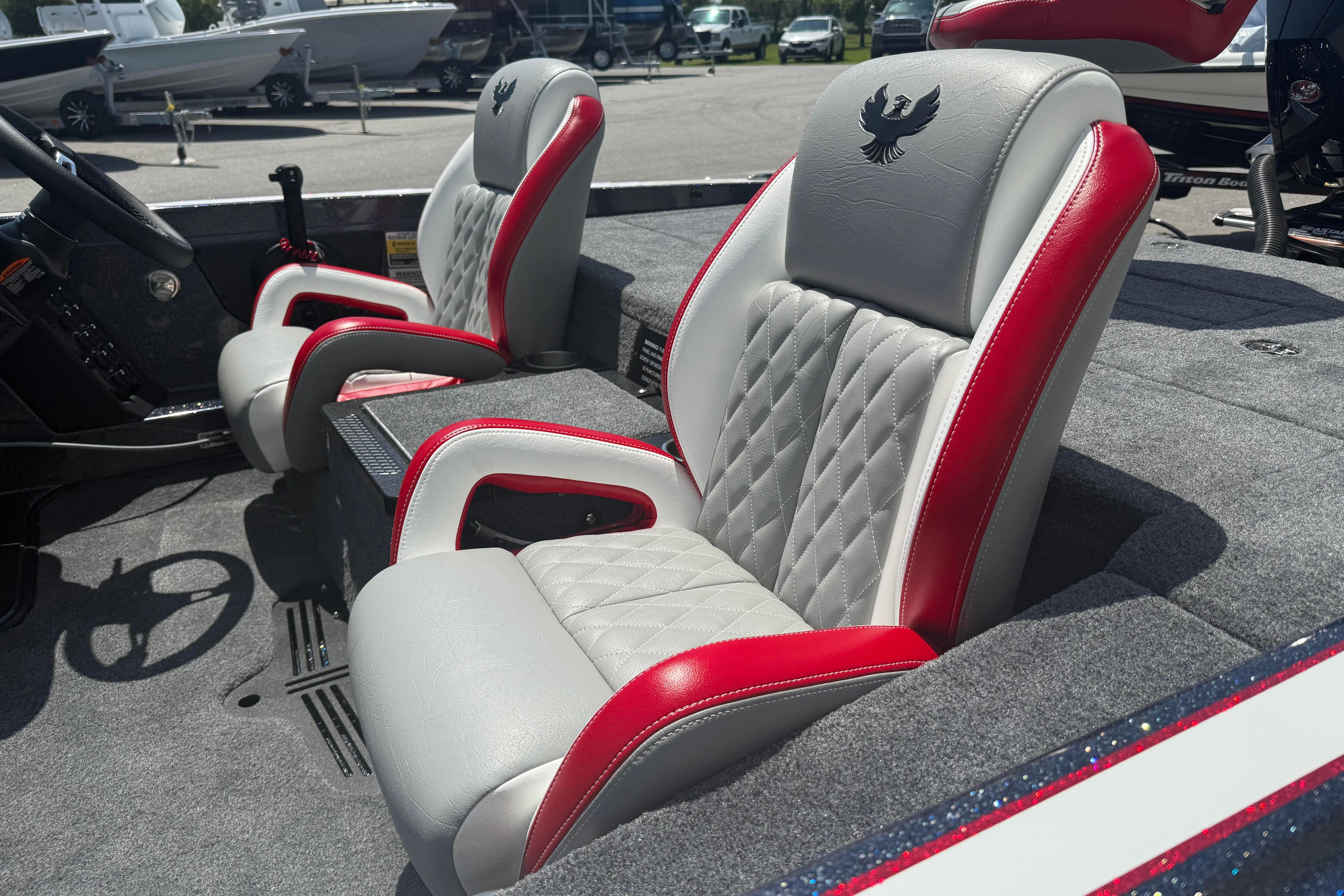 2027 Phoenix 819 ZXL boat interior with red and gray leather seats, diamond stitching.