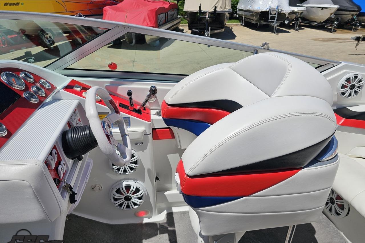 Interior of a 2005 Formula 271 FASTech boat with white, red, and blue seating.
