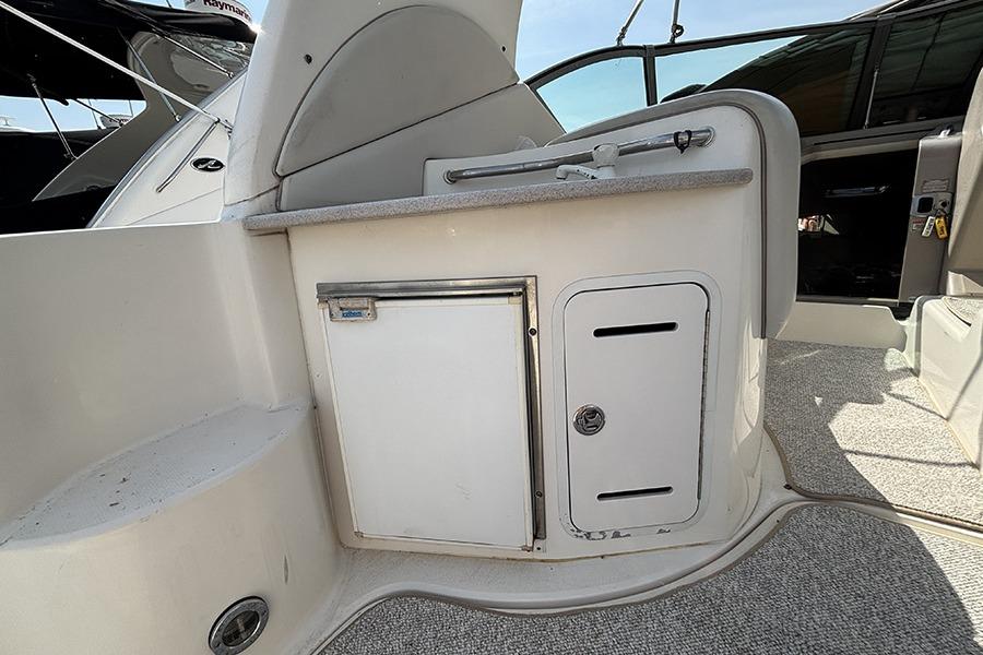 2002 Sea Ray Sundancer 320 boat interior with kitchenette and storage compartments.
