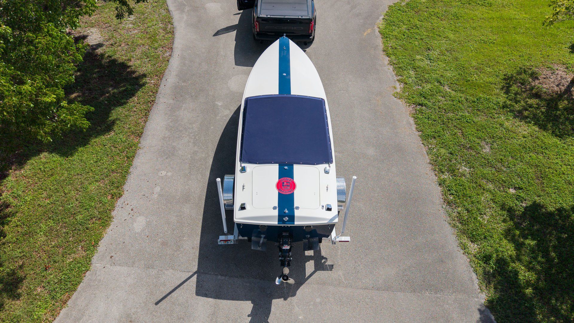A Donzi 22 Classic boat on a trailer, ready for transport.