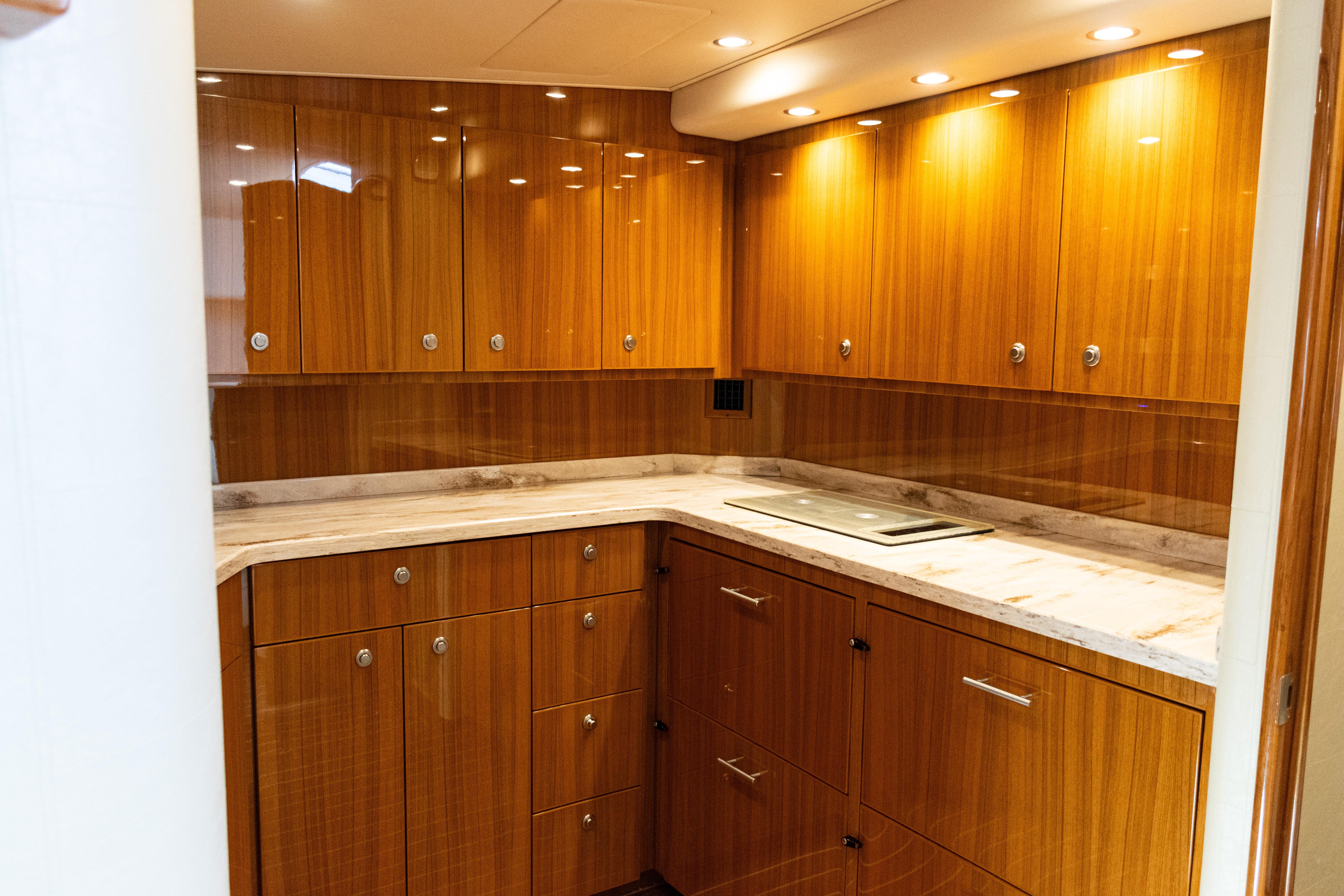 Luxurious wooden cabinetry in 2021 Viking 44 Open yacht kitchen interior.
