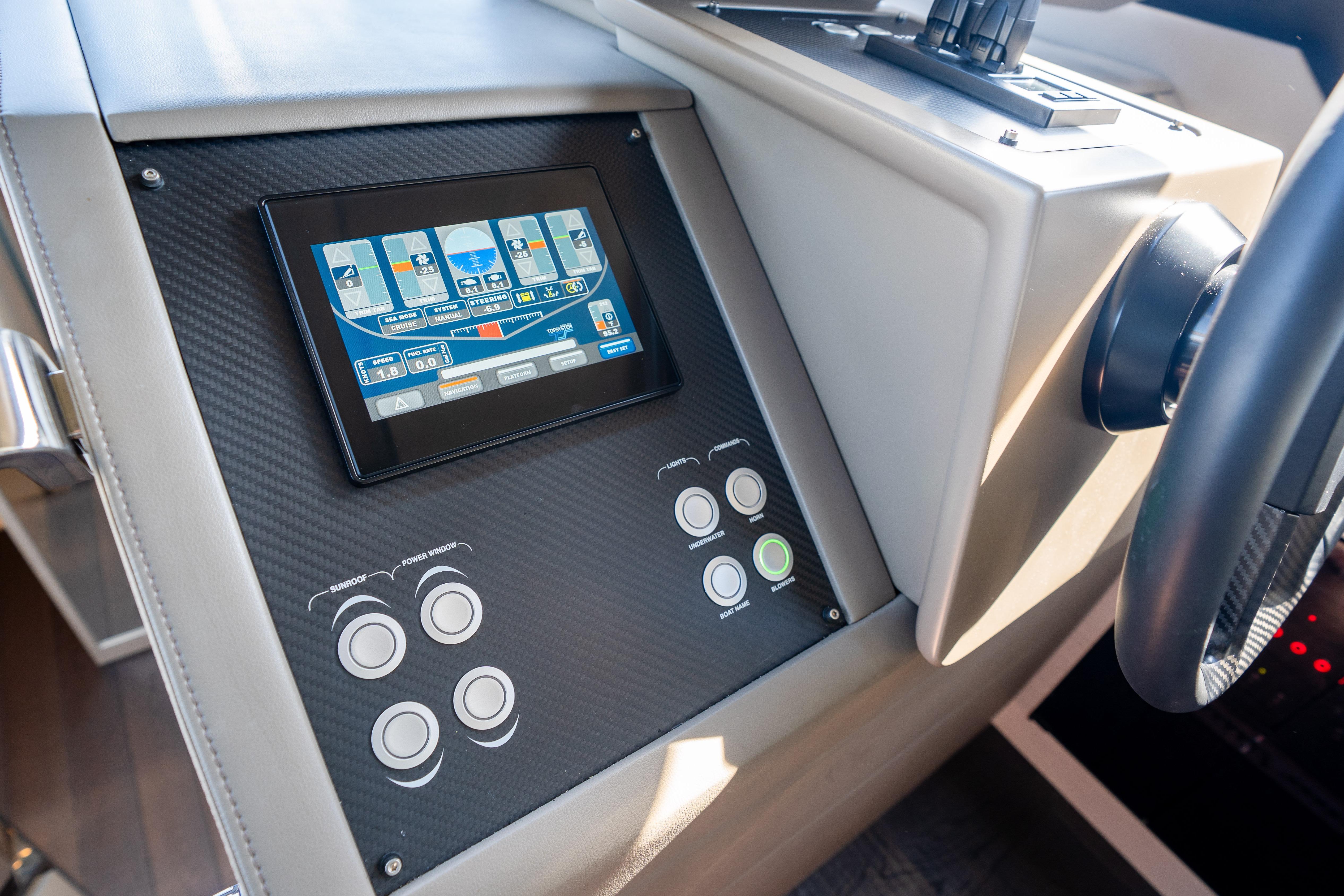 Control panel of 2024 Pershing 7X yacht with touchscreen and buttons.