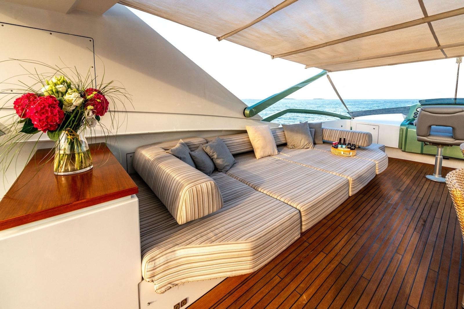 Luxurious deck of 2010 Peri Yachts 29M Custom with elegant seating and ocean view.