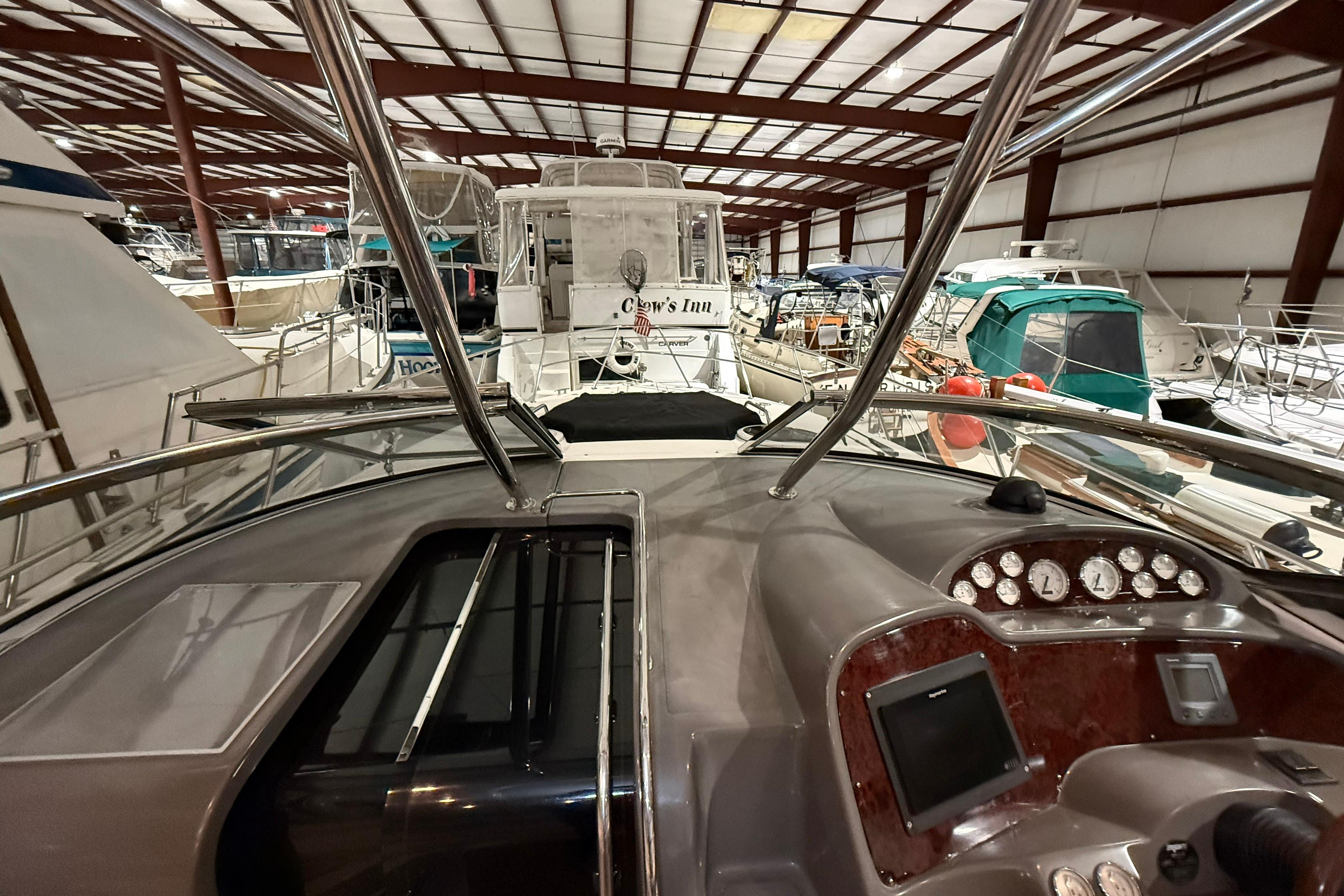2007 Regal Commodore 3760 IO yacht interior, showcasing dashboard and marina setting.