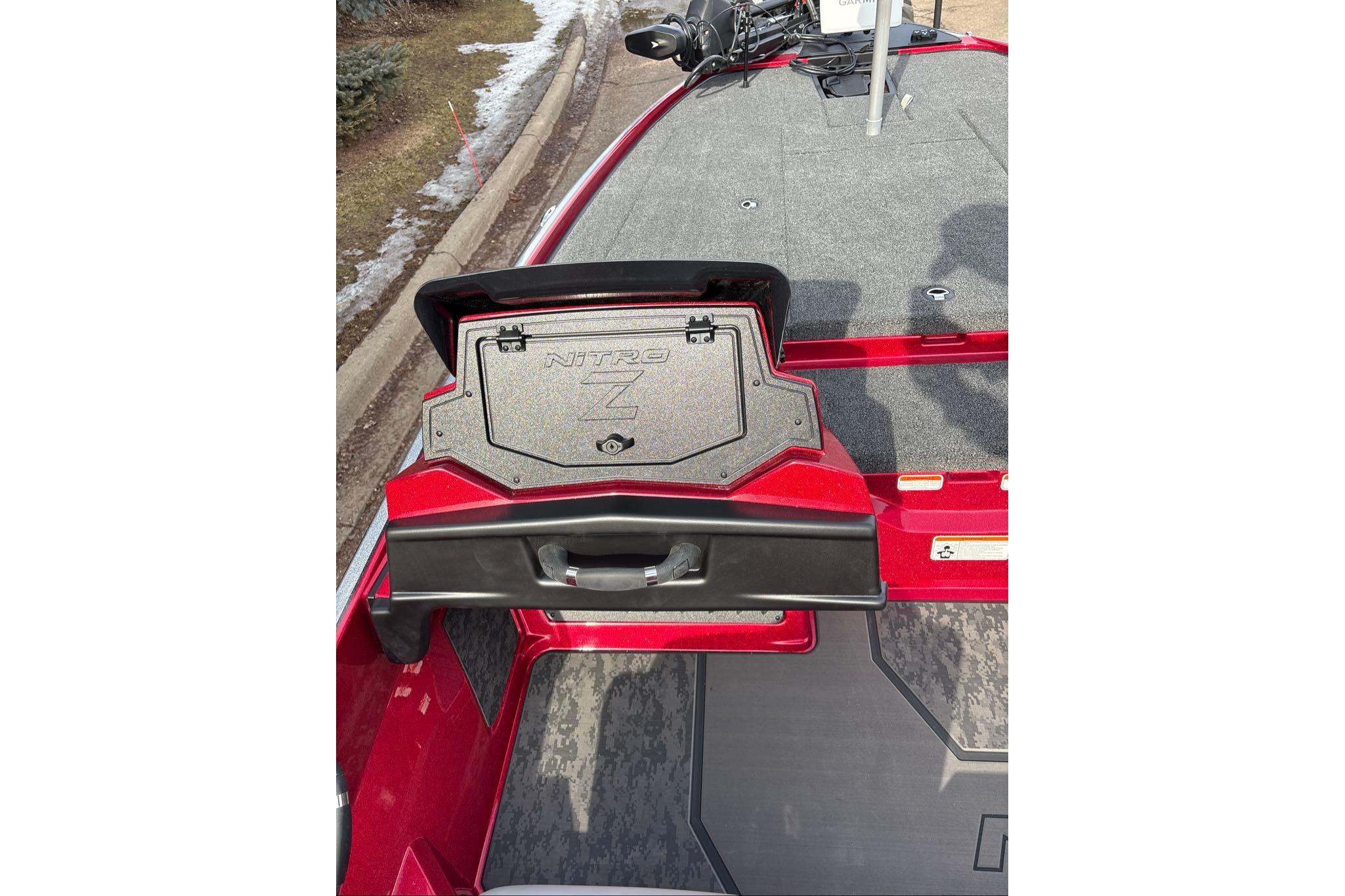 2026 Nitro Z20 XL Pro boat with open storage compartment, red and gray design.
