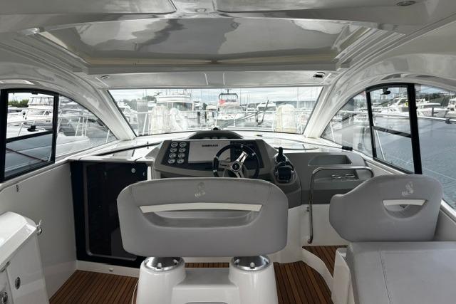 Interior view of 2013 Beneteau Gran Turismo 38 yacht cockpit with modern controls and seating.