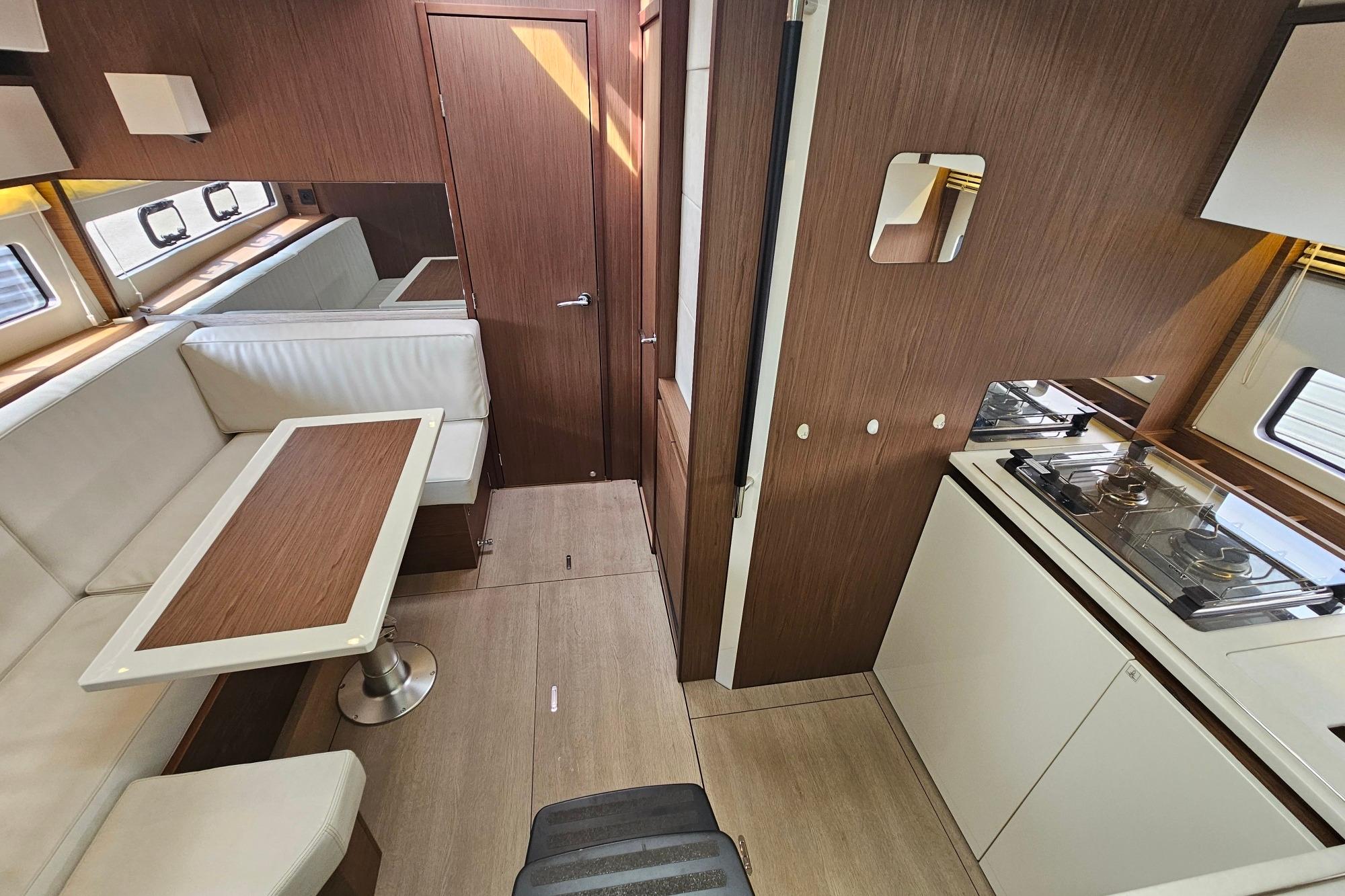 Interior of 2017 Jeanneau Leader 40 yacht with modern kitchen and dining area.