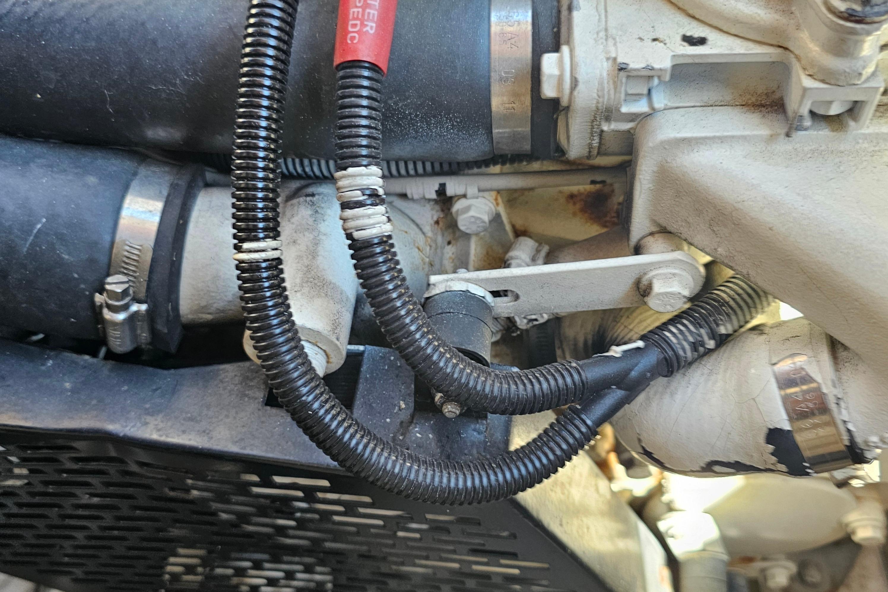 Close-up of 2005 Regal Commodore 4260 engine components with hoses and wiring.