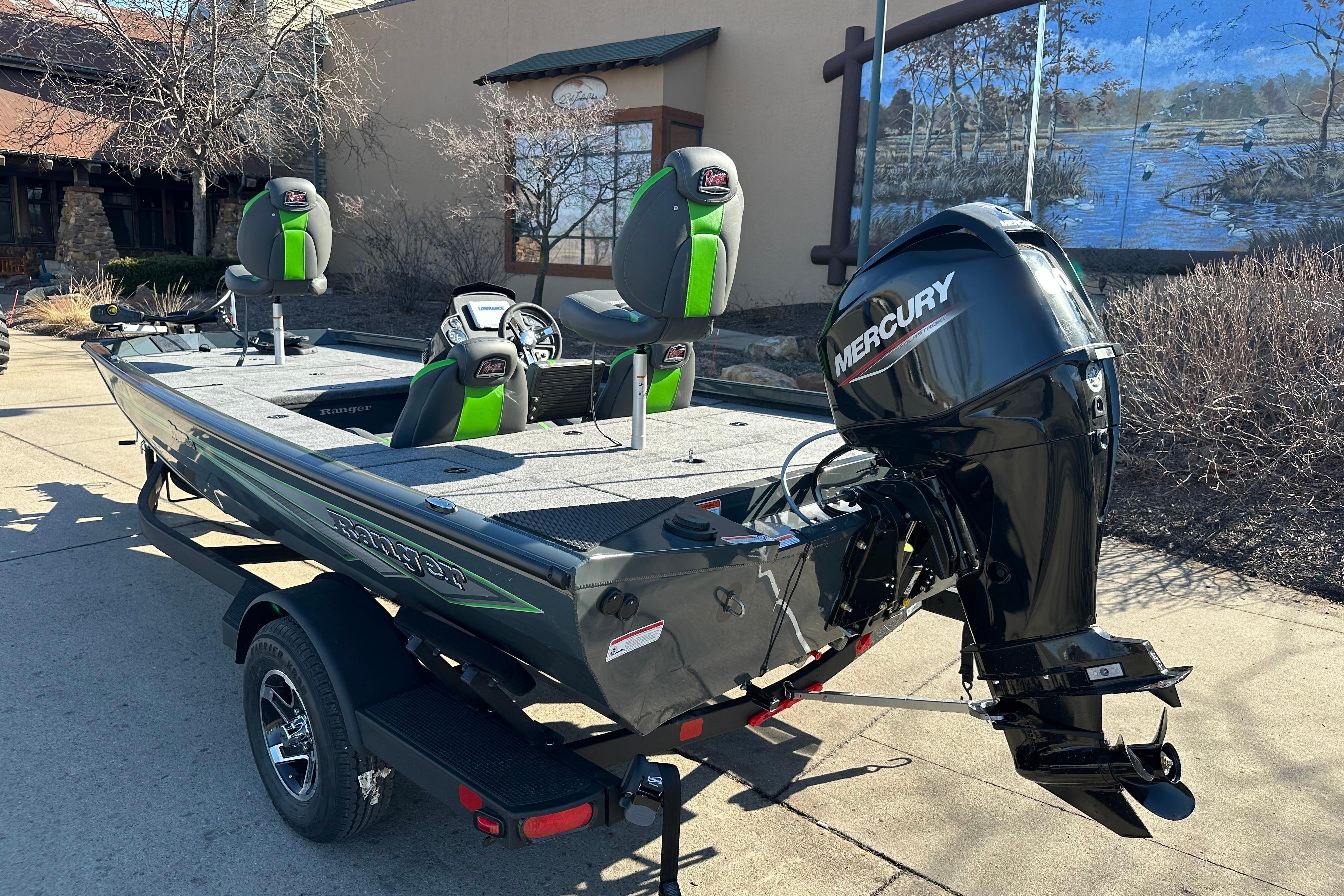 2026 Ranger RT178C fishing boat with Mercury engine, parked outdoors.