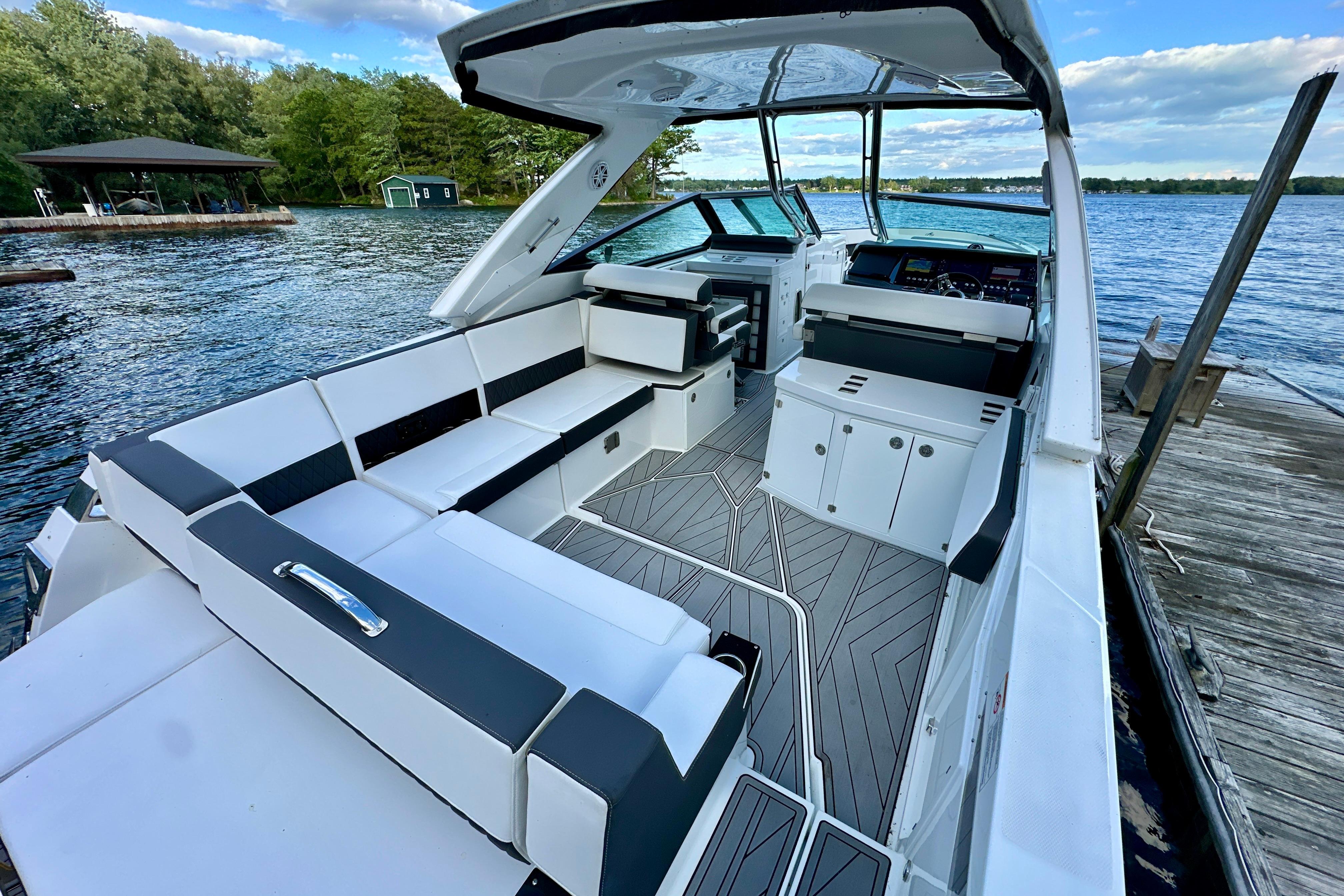 2022 Monterey 378SS Super Sport boat interior with sleek seating and modern design by the lake.