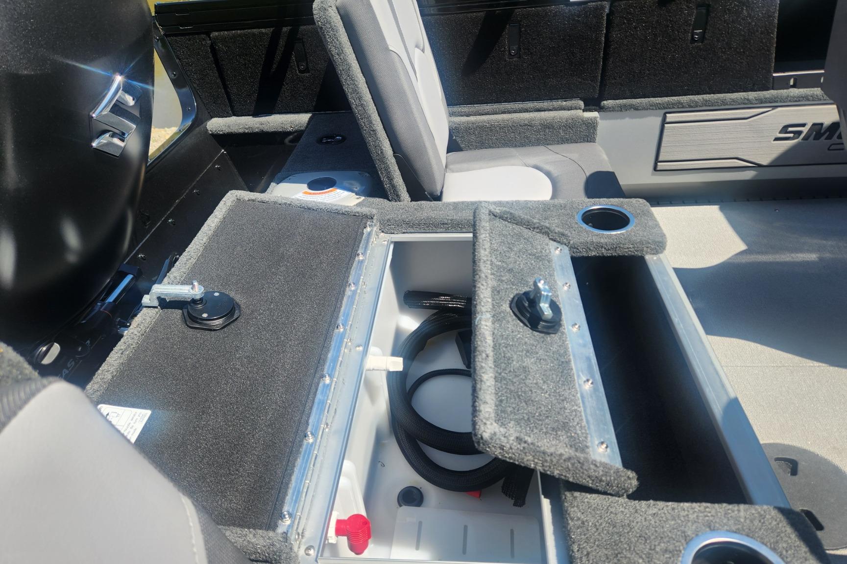 2026 Smoker Craft Adventurer 210 GLS Sport boat interior with open storage compartment.