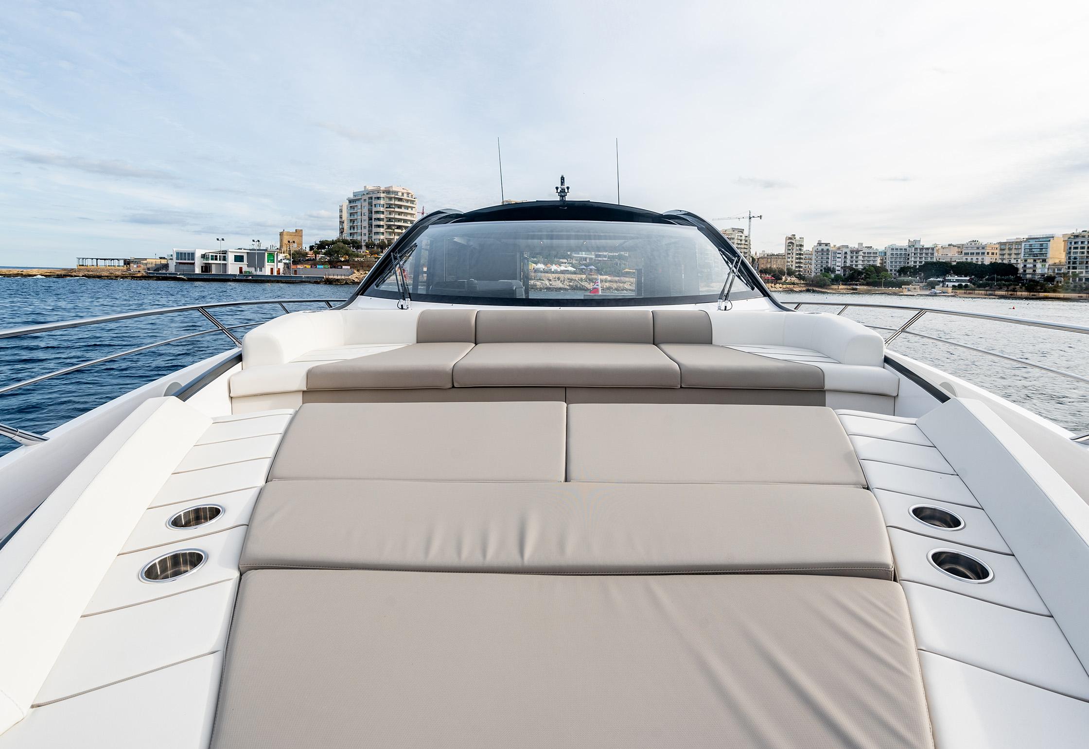 2023 Sunseeker Predator 65 yacht with spacious deck and luxurious seating.