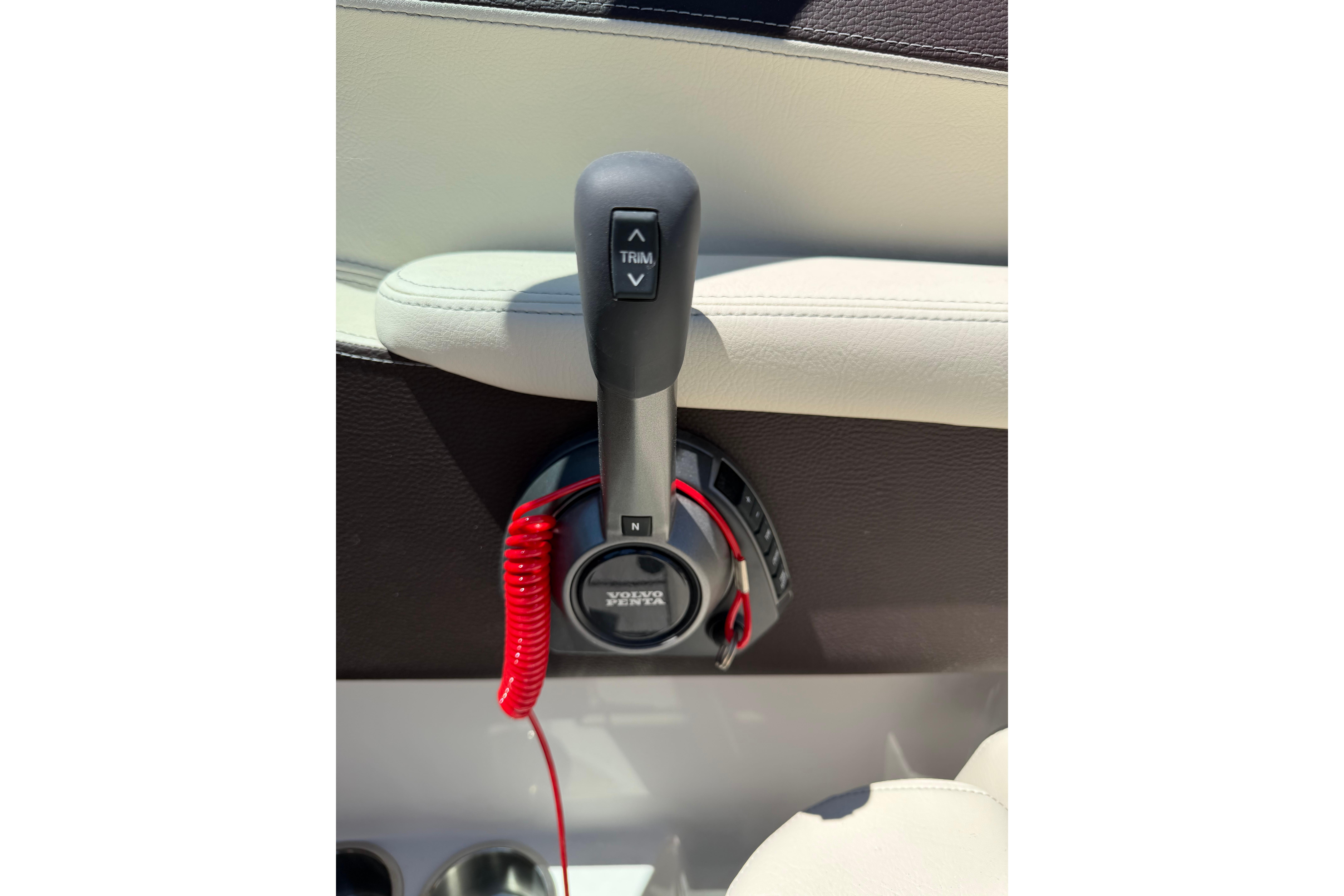 Throttle control lever in a 2026 Regal LS4 boat, featuring Volvo Penta branding.